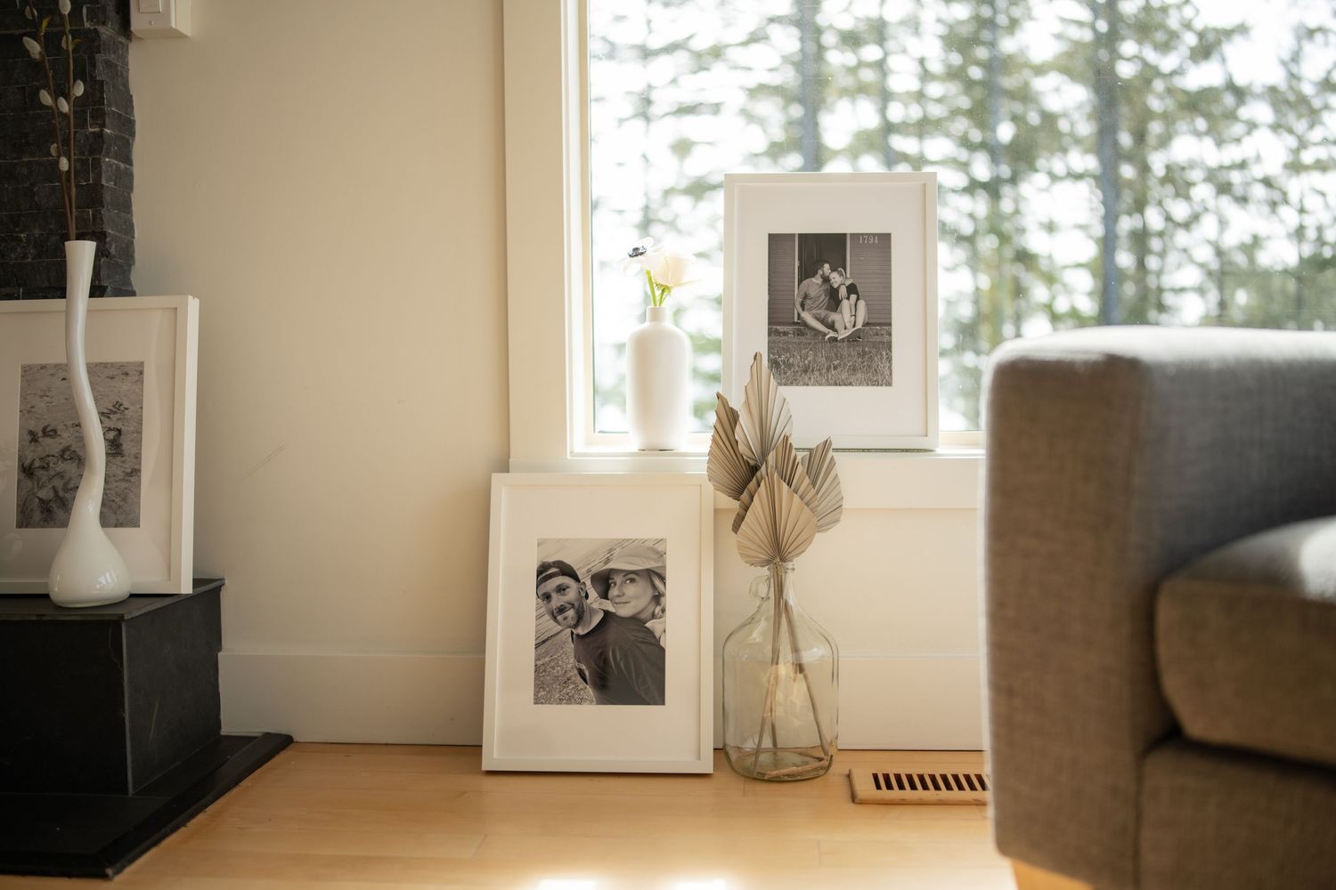 Modern interior room with framed photos and decorative items on display.