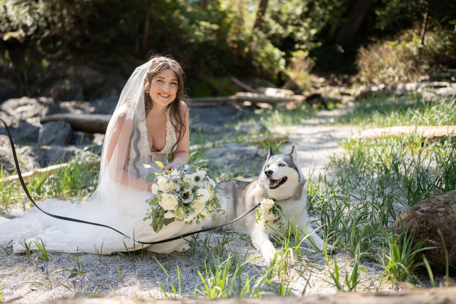 Wedding photos being taken in a natural outdoor setting with greenery and rocks.