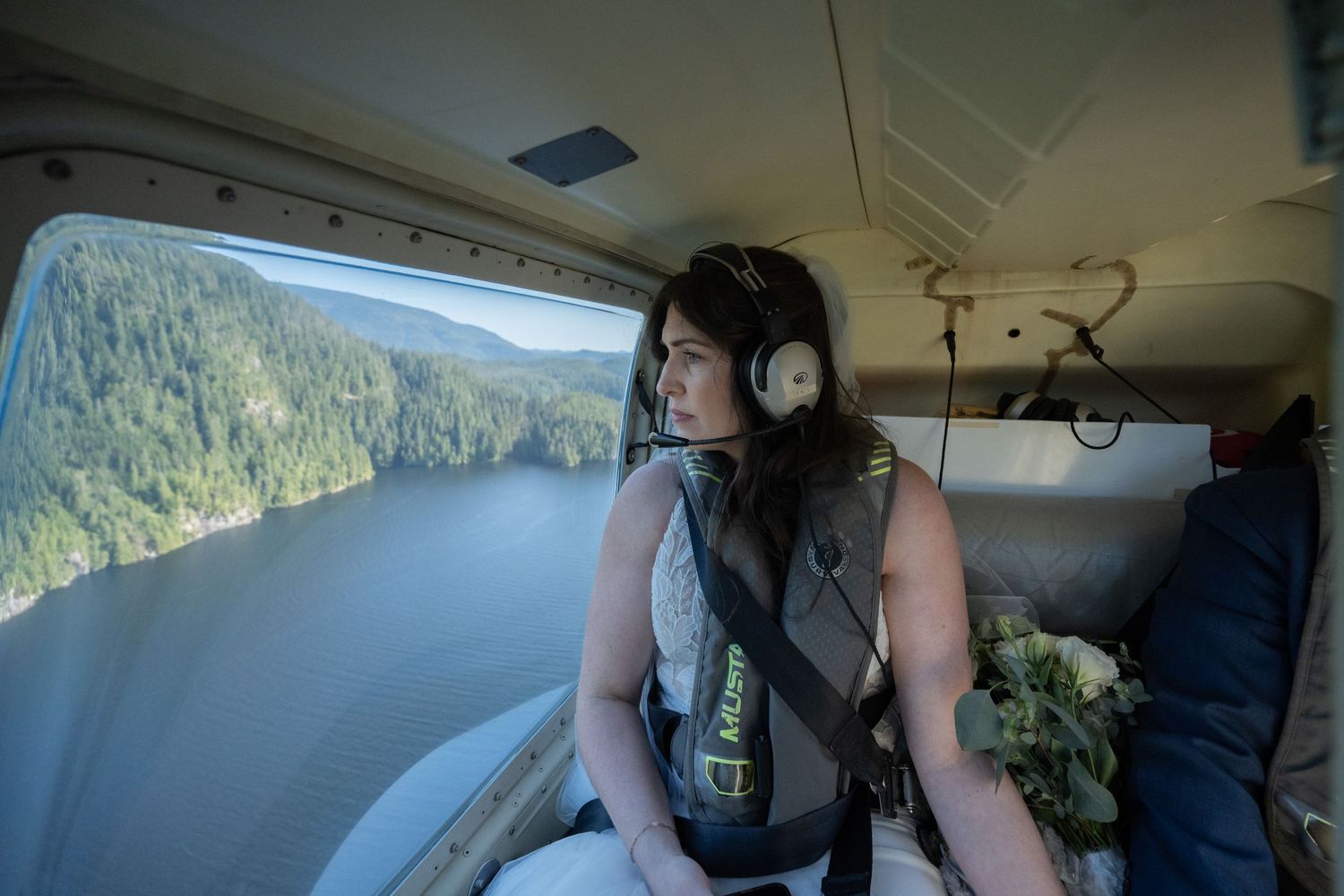 Interior view of helicopter cockpit during scenic mountain flight.