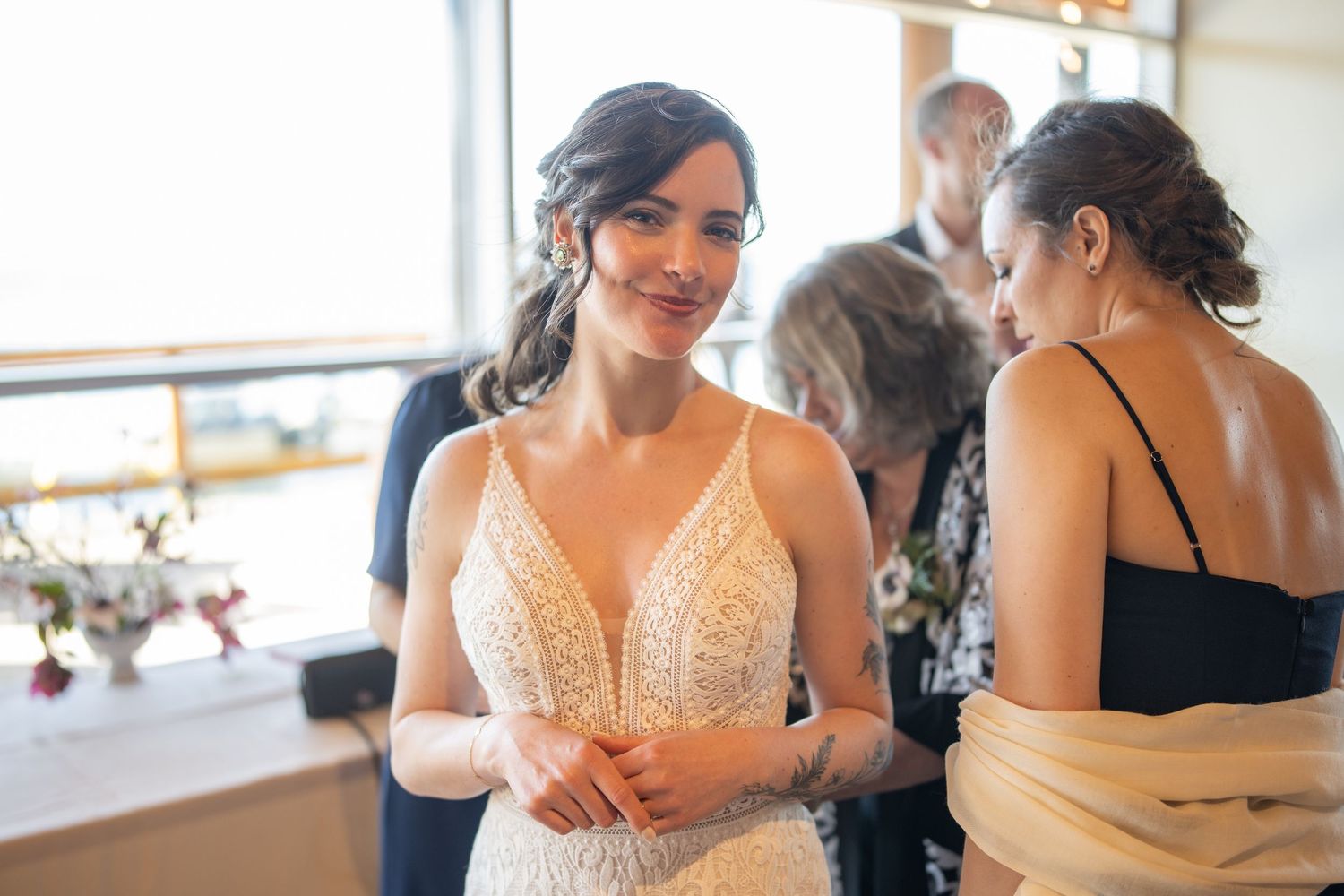 Elegant wedding party preparations in a bright sunlit room.