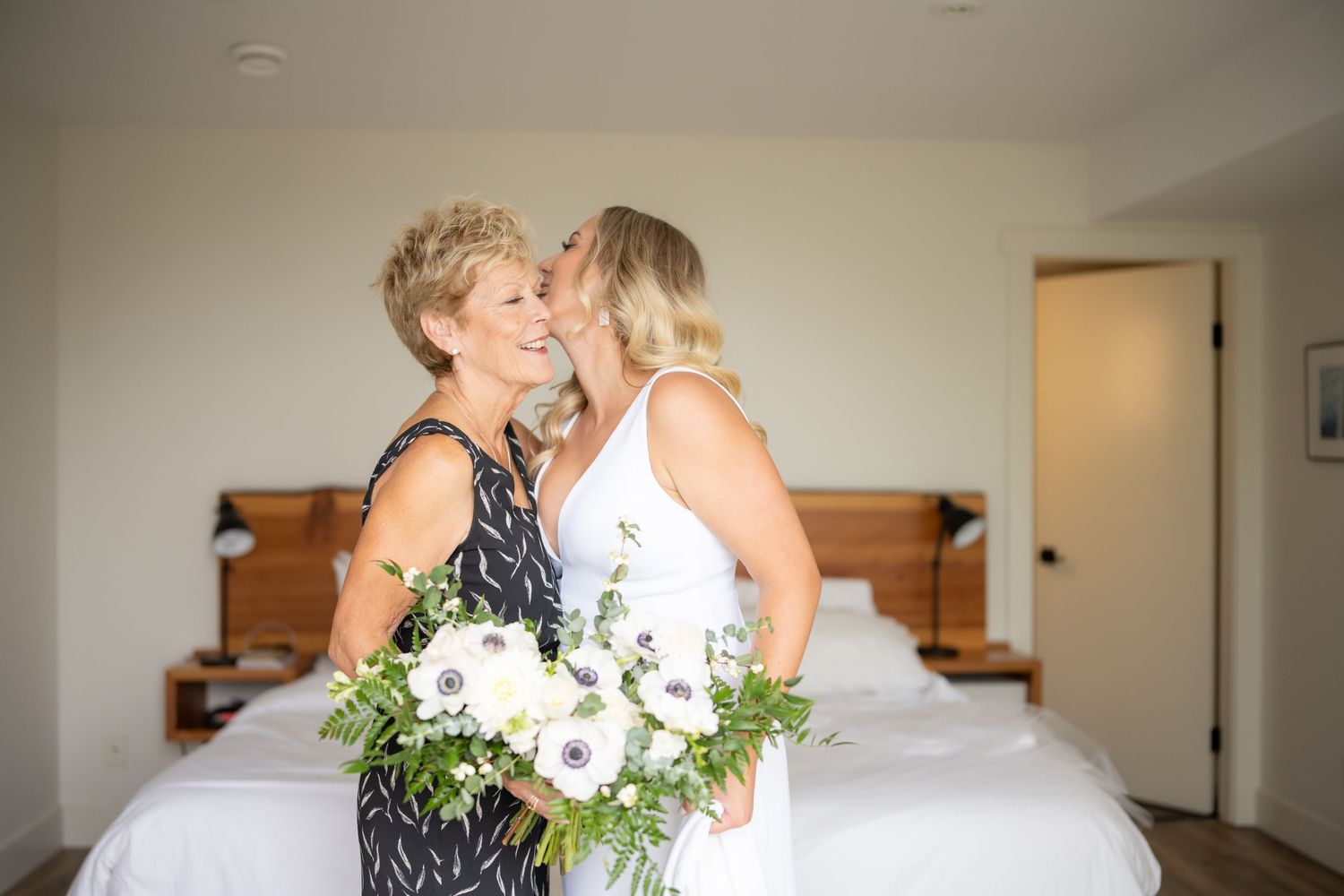 Bride and family members share heartfelt moments while getting ready for the wedding.