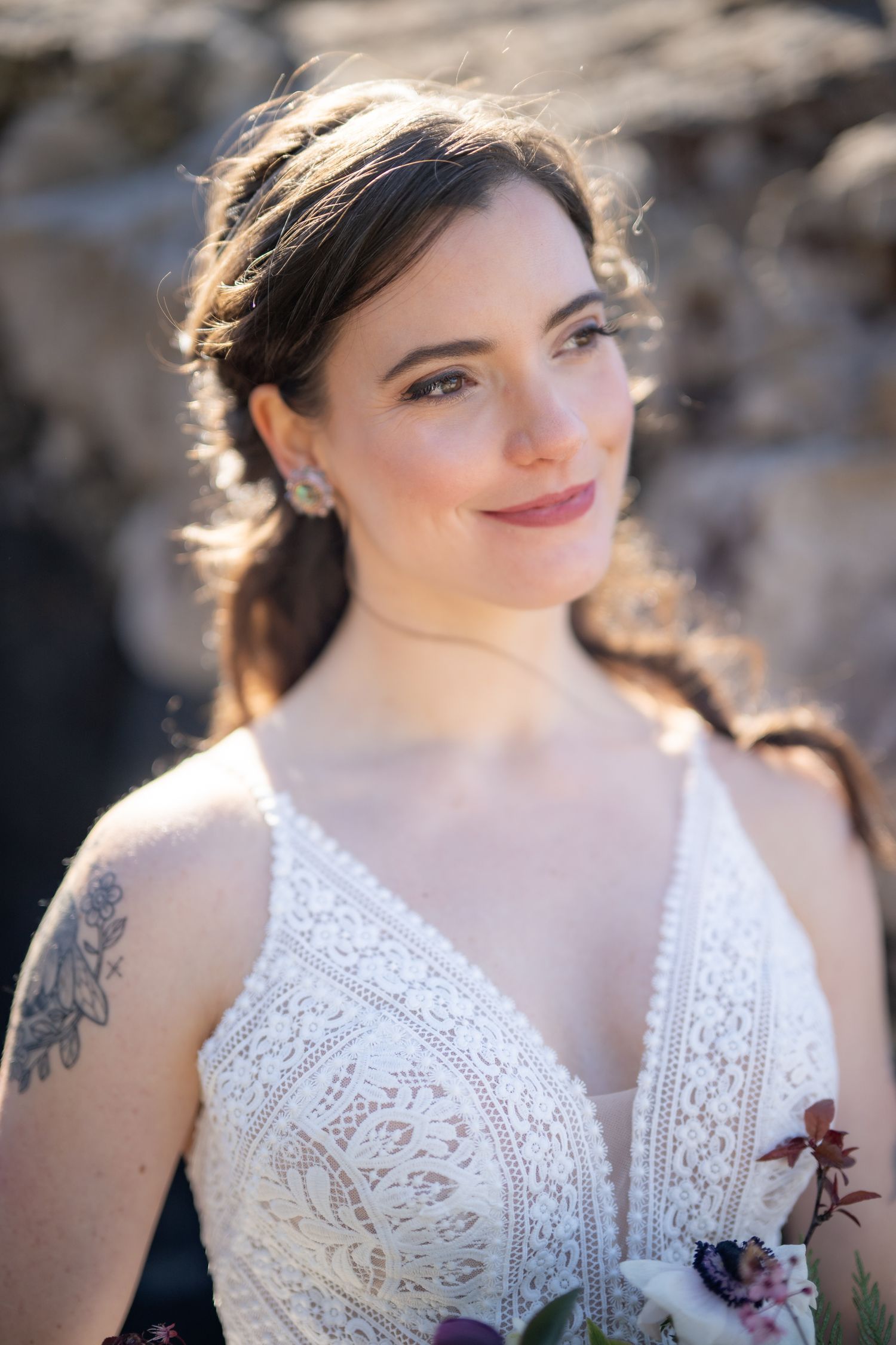 Delicate white lace wedding dress details with intricate patterns.