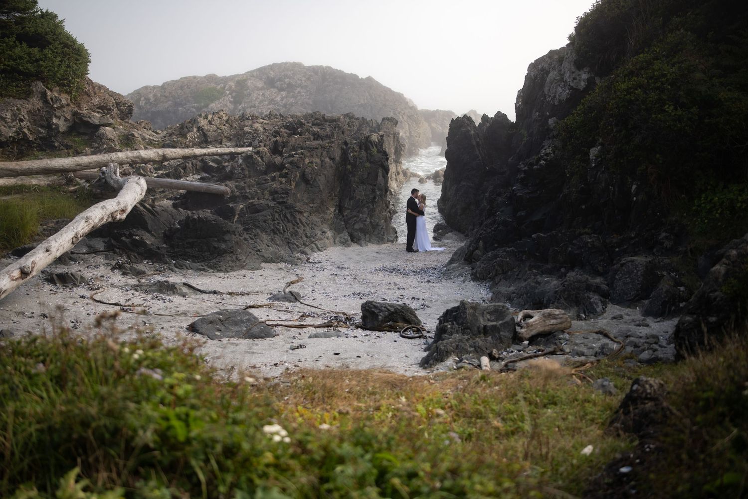 Panoramic view of rugged coastline with dramatic cliffs and rocky formations.