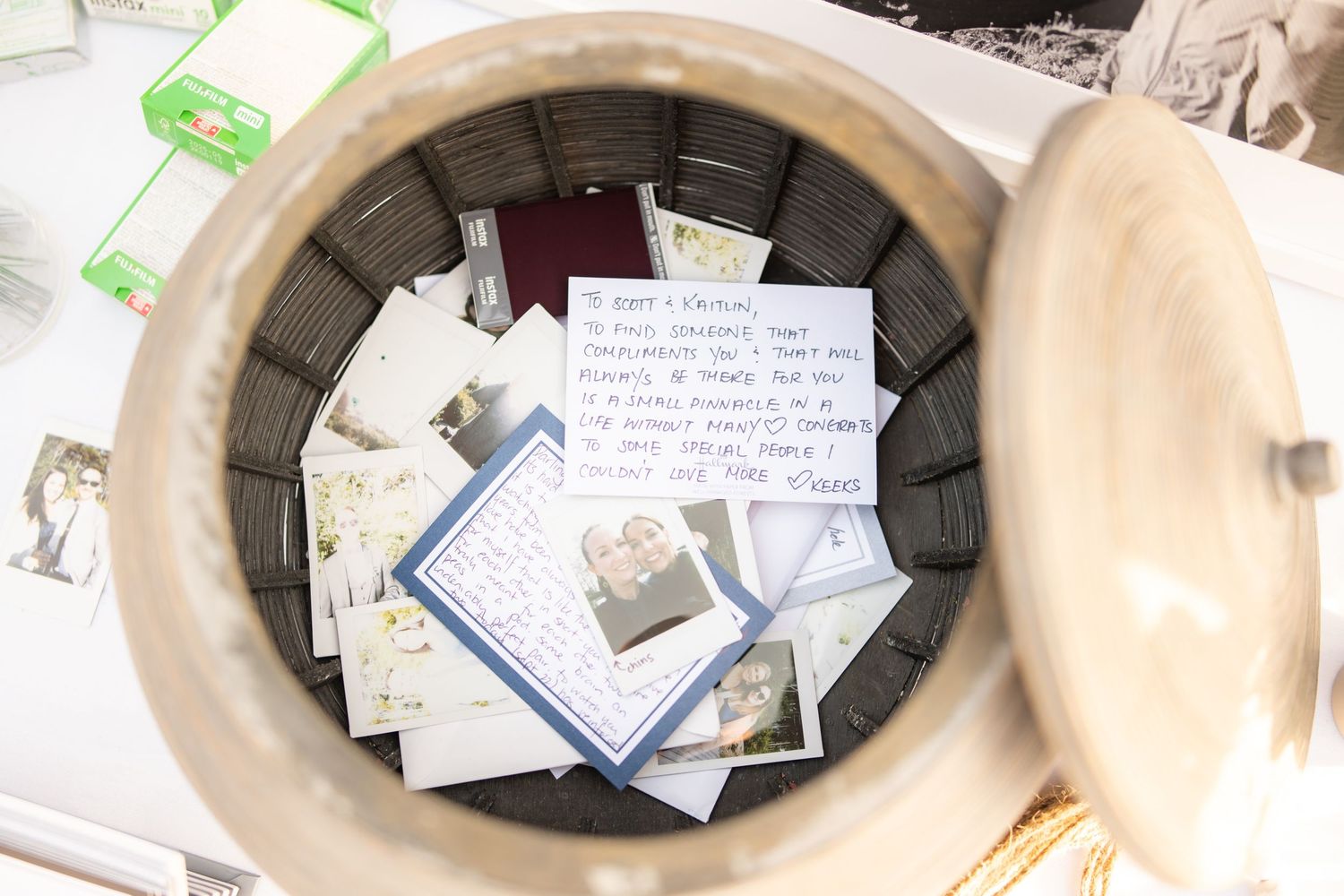 Collection of handwritten notes and memories gathered in decorative container.