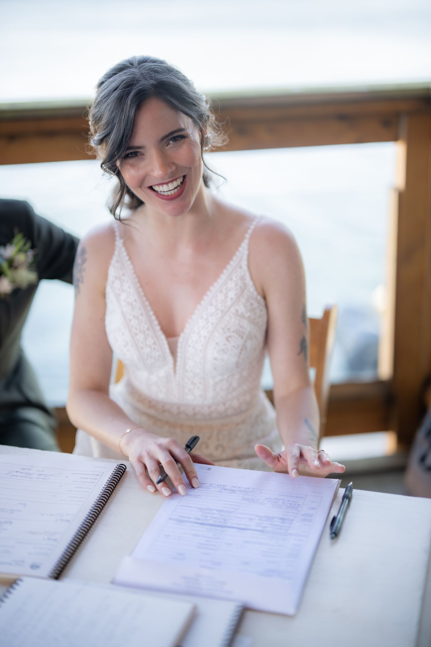 Close-up of document signing at a wedding ceremony.