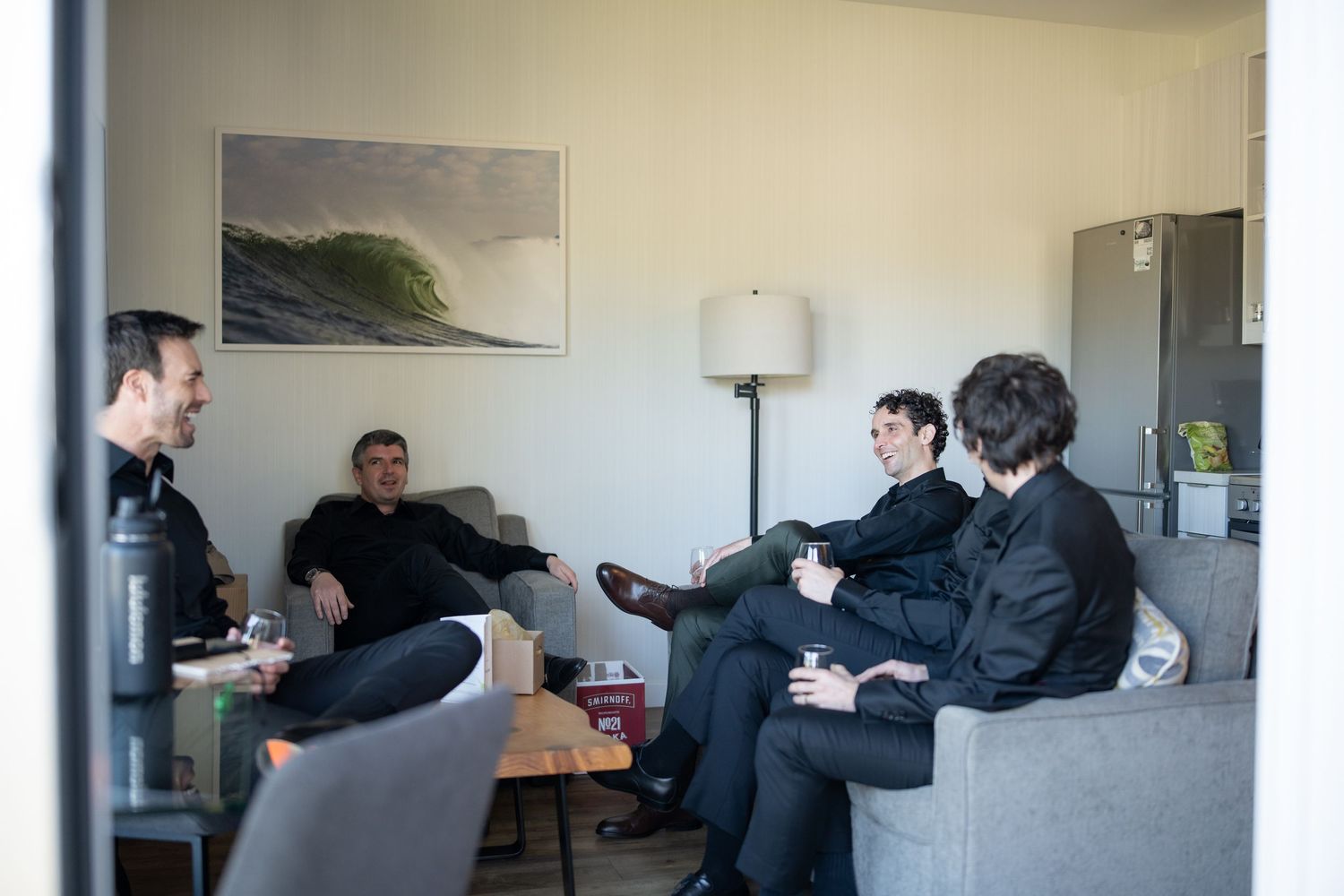 People sitting at tables in a casual office or meeting space.