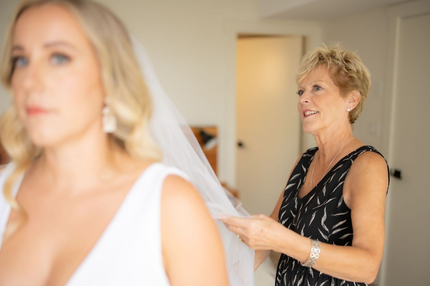 A wedding preparation scene showing emotional moments in an indoor setting.