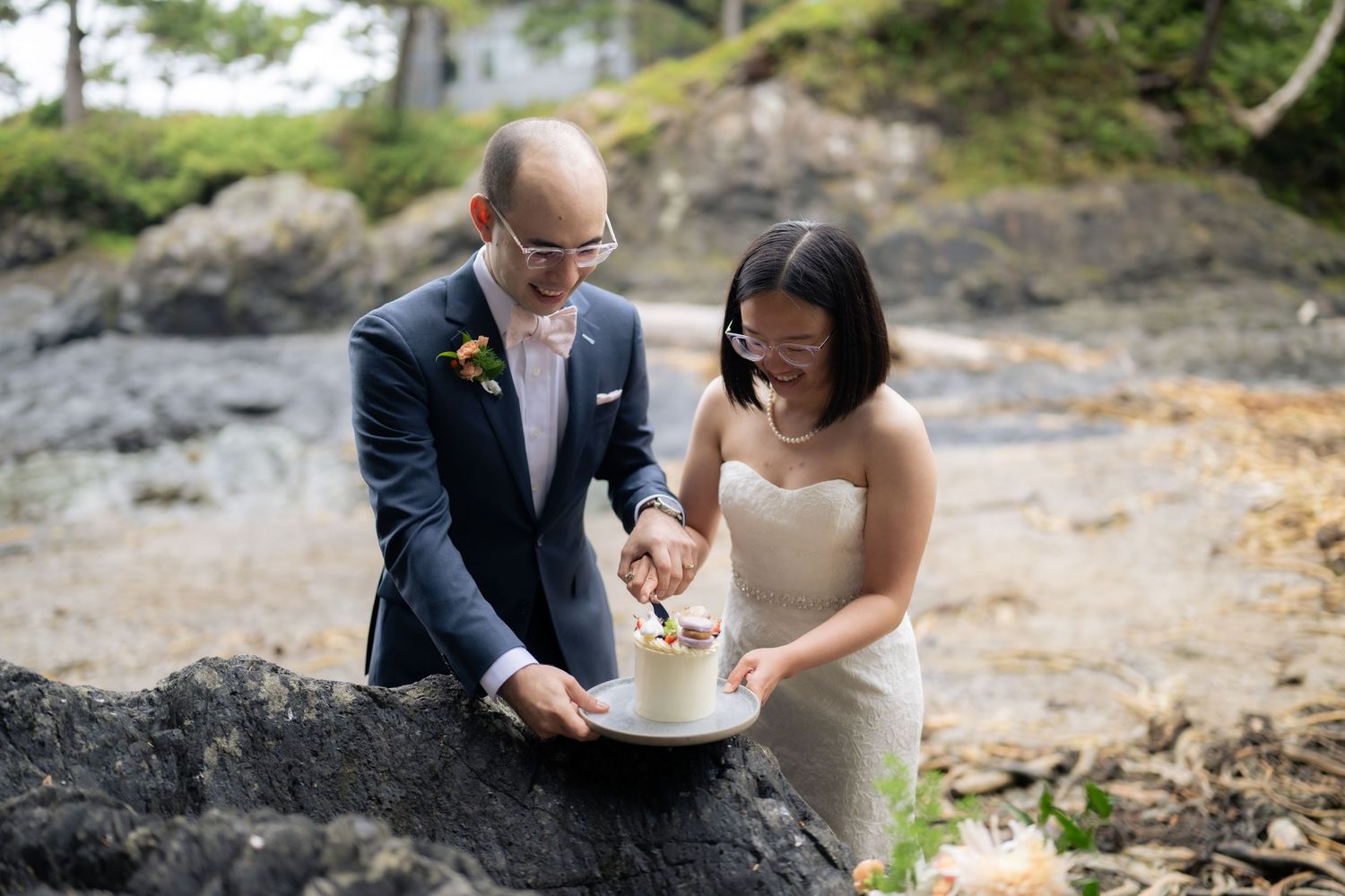 Couple shares emotional vow reading moment during their beach wedding ceremony.