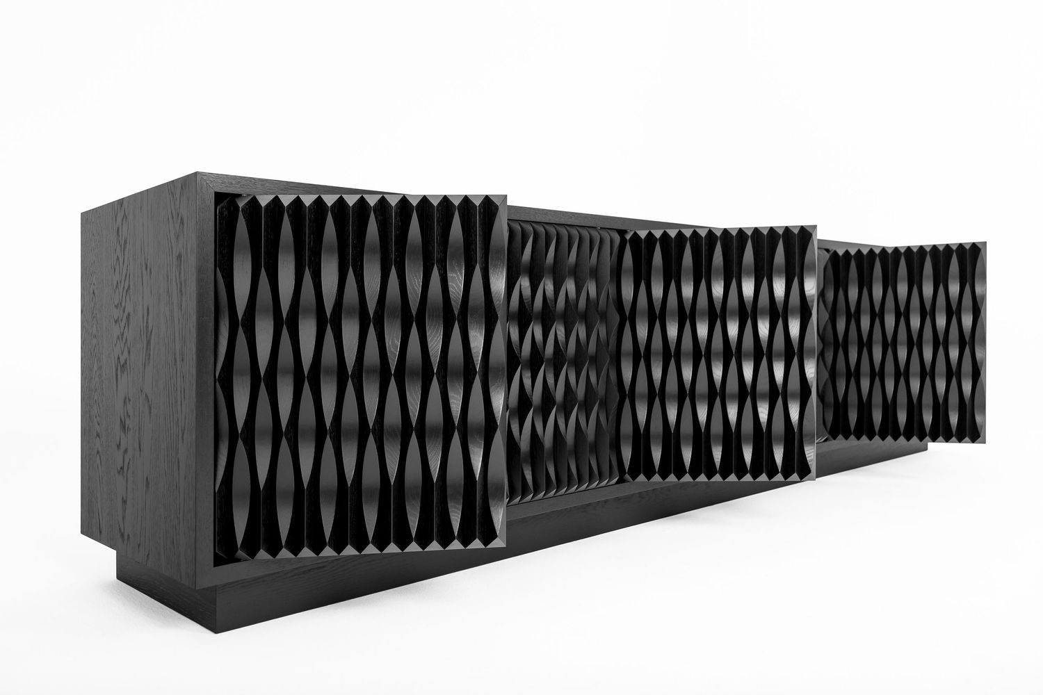 Modern black oak sideboard with sculptural carved wave-pattern doors, shown with several doors open on a white background.