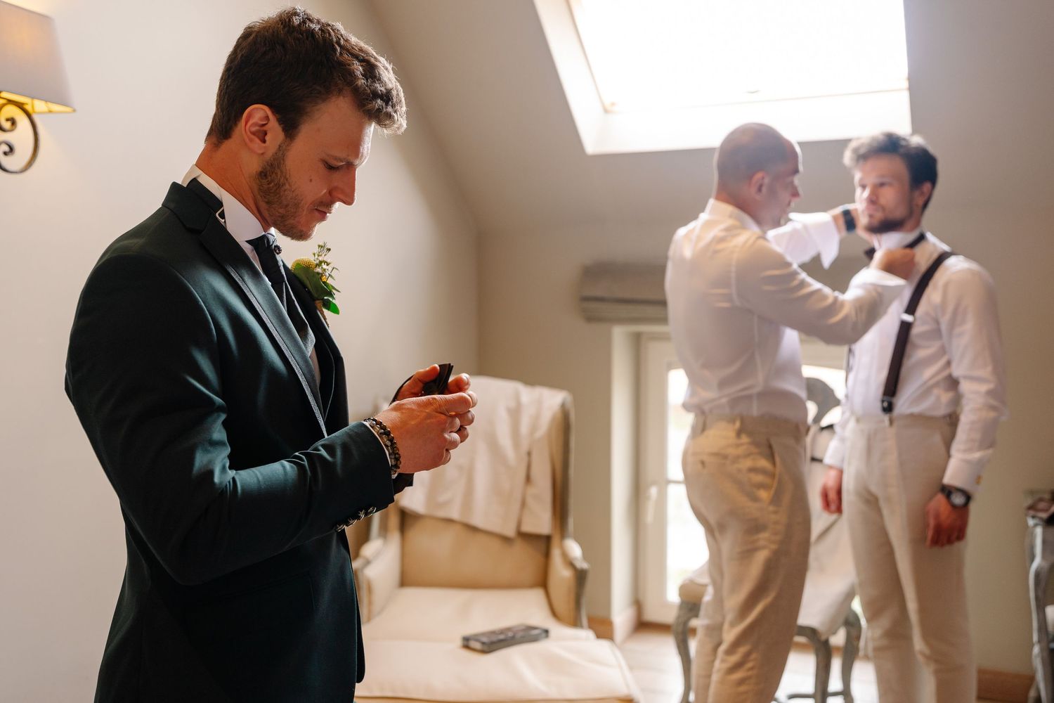 A series of photos showing a person in business attire checking their phone while standing in a bright office hallway.