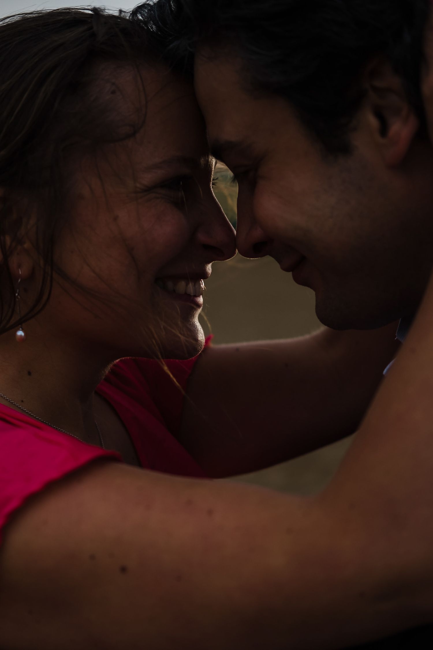 A romantic silhouette sequence shows an intimate moment between two people in dim lighting.