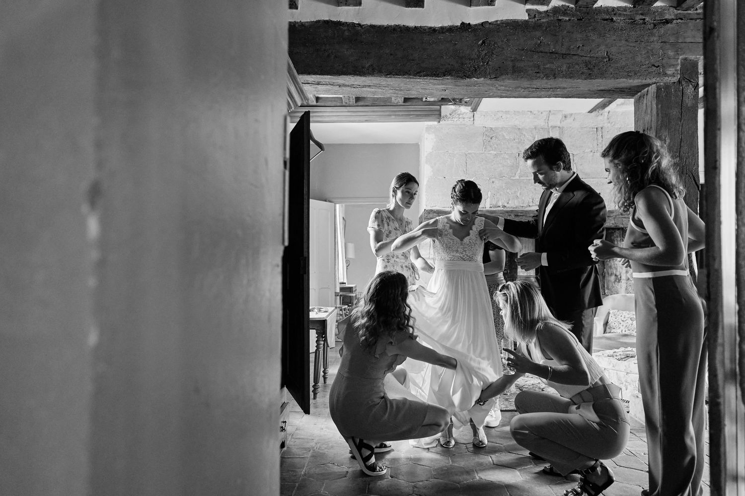 Black and white photo series showing medical professionals working with patients in a hospital setting.
