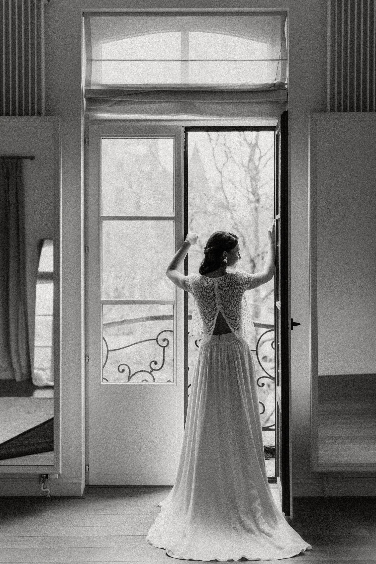 A series of black and white photos showing a wedding dress silhouetted against bright windows in an empty room.