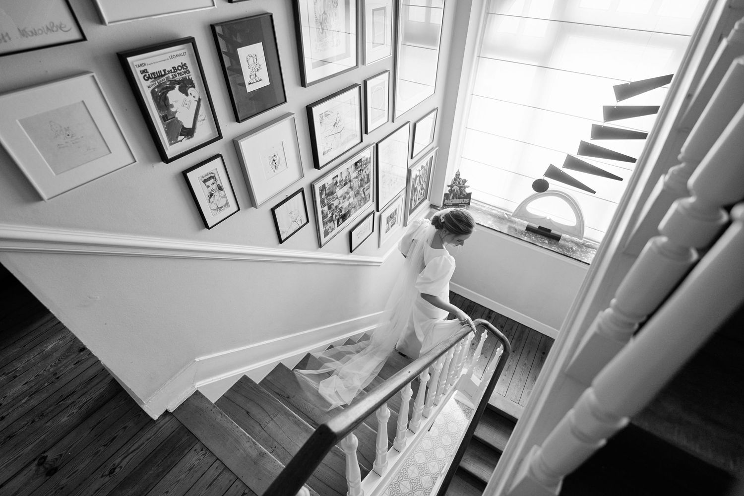 A series of black and white photographs showing interior stairways and architectural details in a classic building.