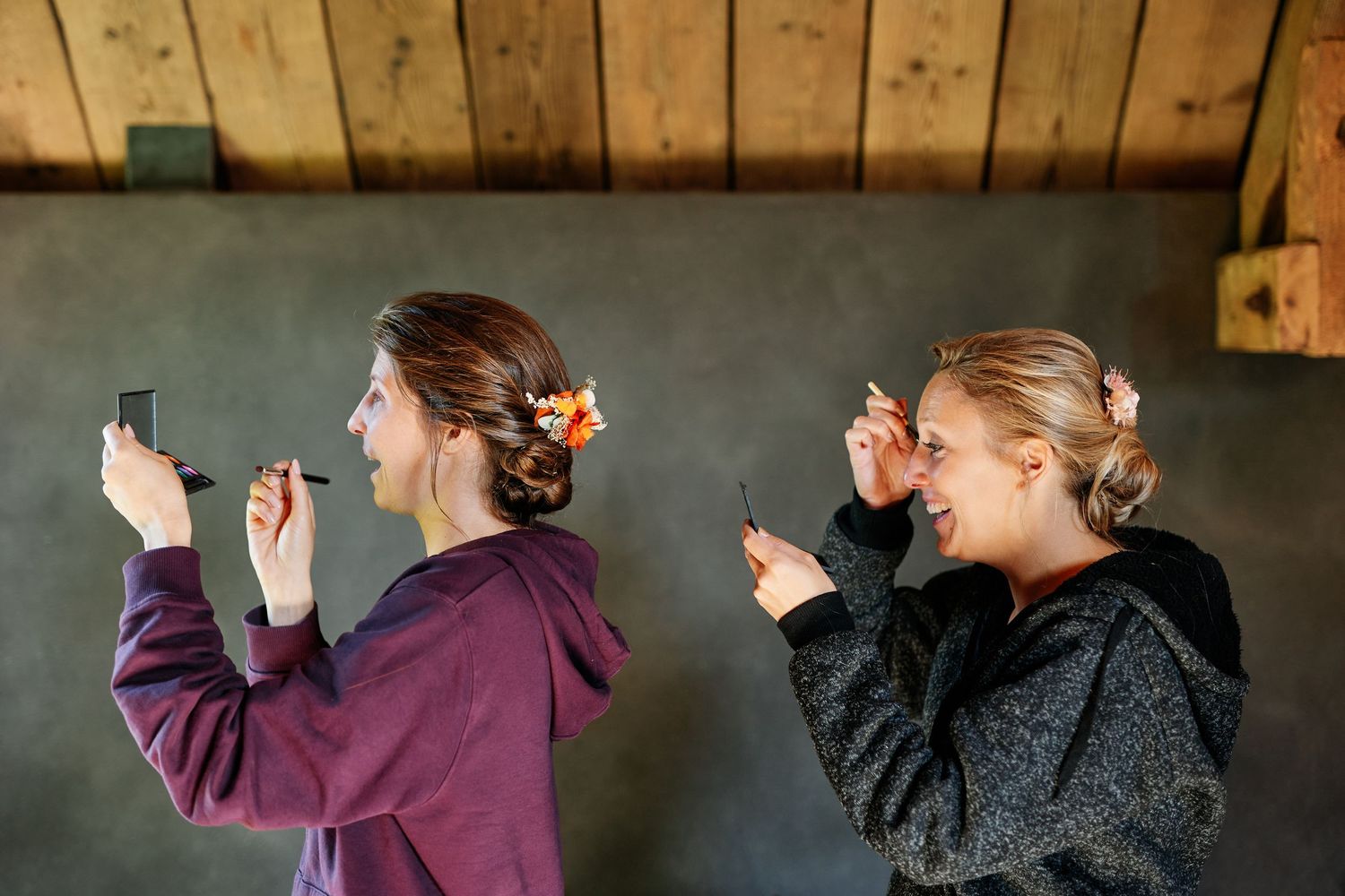 A series of dance poses shown in a wooden barn setting with purple and black outfits.