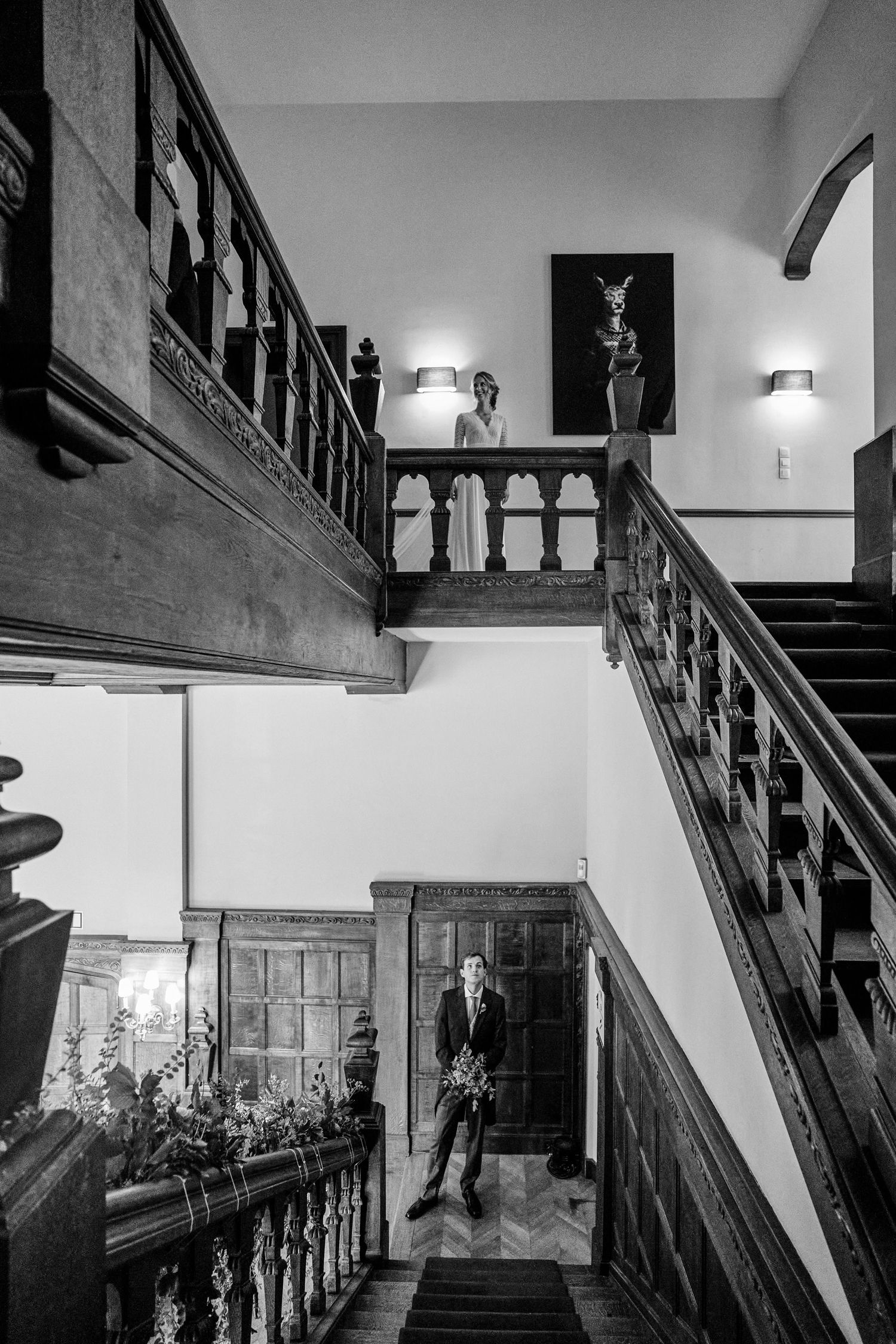 A series of black and white photographs showing dark wooden staircases and hallways in an old building interior.