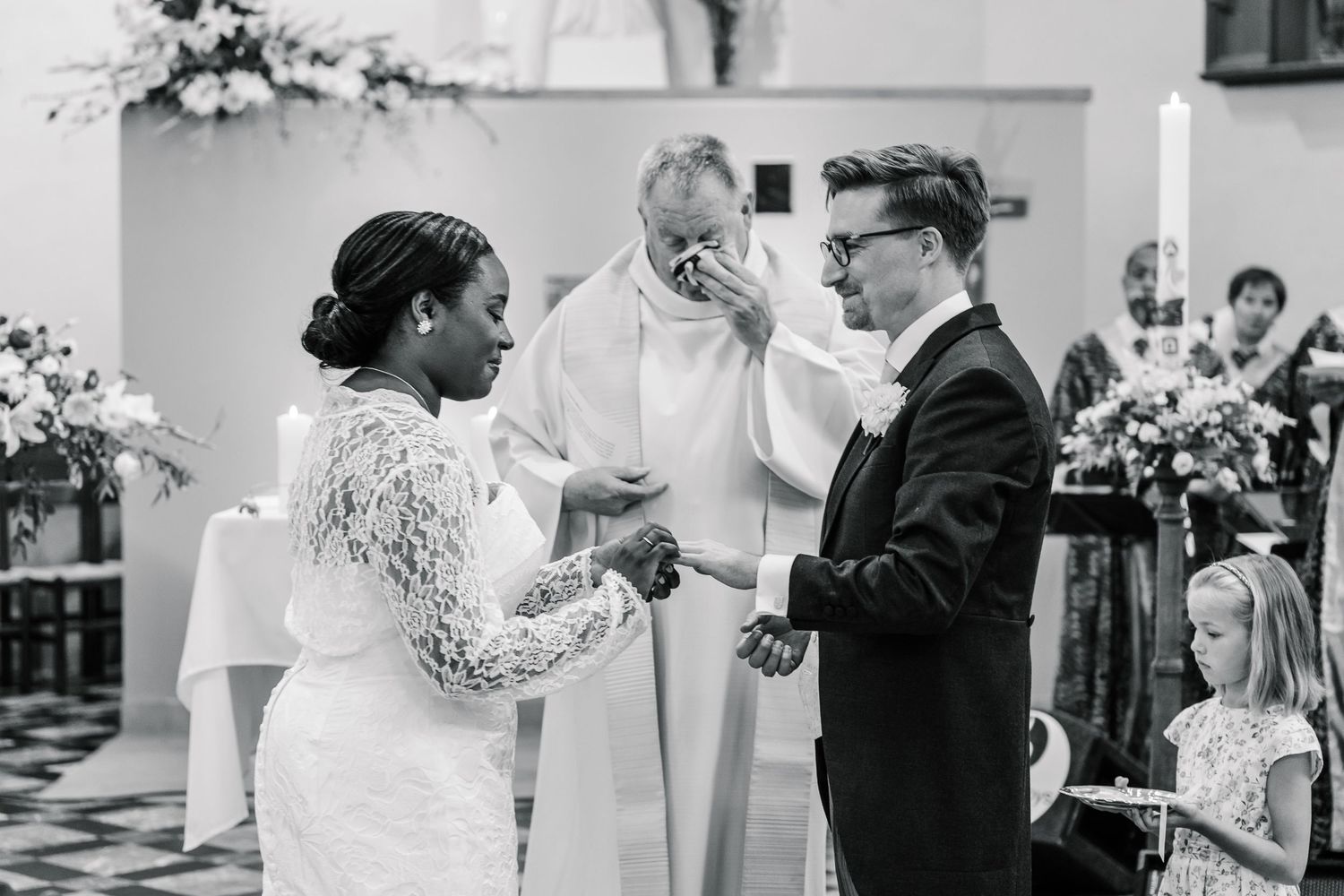 A black and white photo collage of wedding reception scenes showing couples dancing and celebrating together.