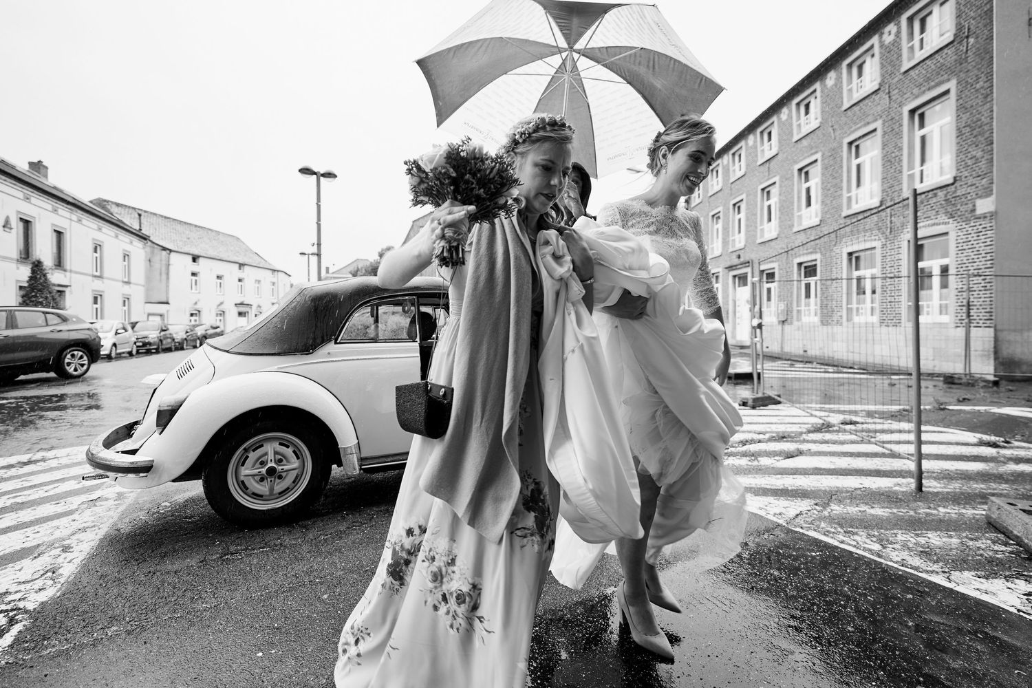 A collection of black and white vintage photographs showing cars, umbrellas and residential streets in an urban setting.