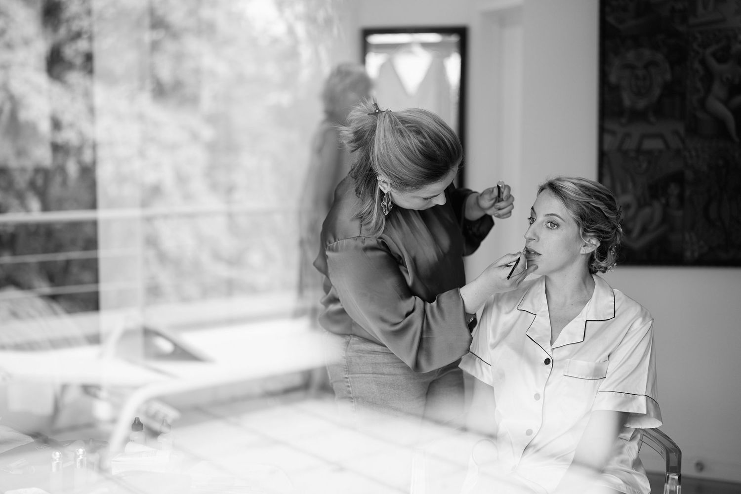 A series of black and white photographs showing intimate moments between two people in conversation and embrace.