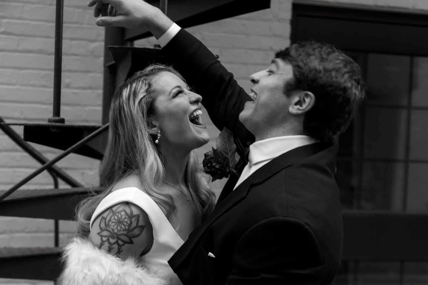 Romantic couple shares an intimate moment together in black and white photography.