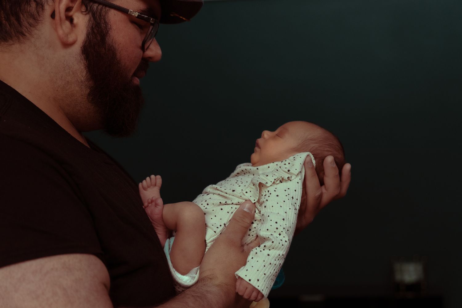 A sequence of tender moments between two people showing affection and closeness in dim lighting.
