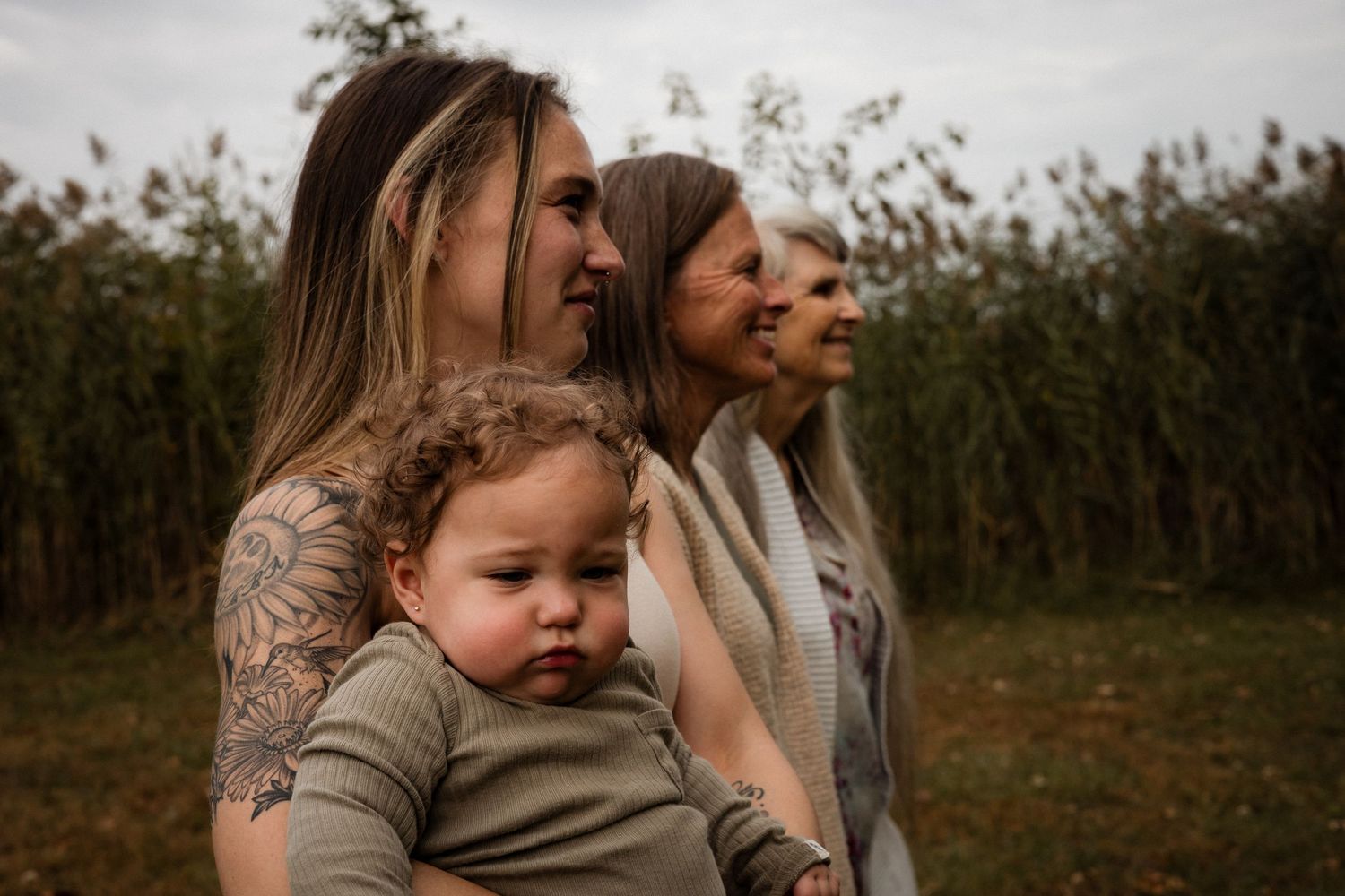 A collection of outdoor family photos showing tender moments between parents and children in a natural setting at sunset.