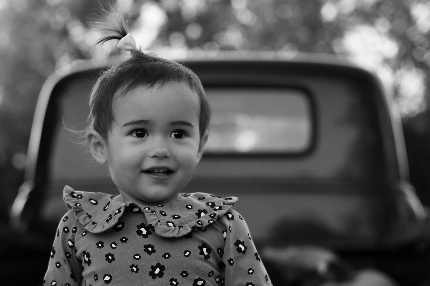 A black and white photo montage showing candid moments and expressions arranged in a horizontal sequence.