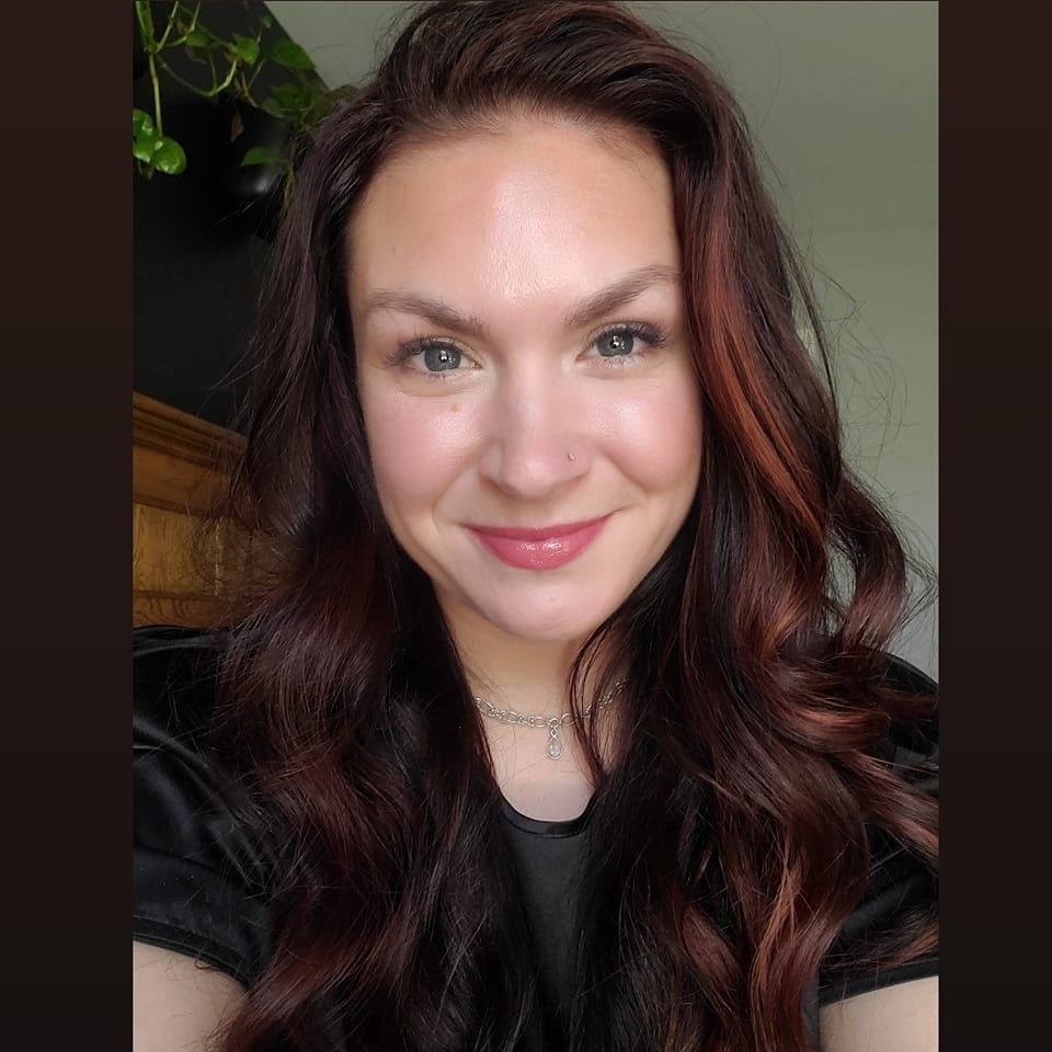 A series of selfie photos showing someone with long dark wavy hair and a warm smile against a light background.