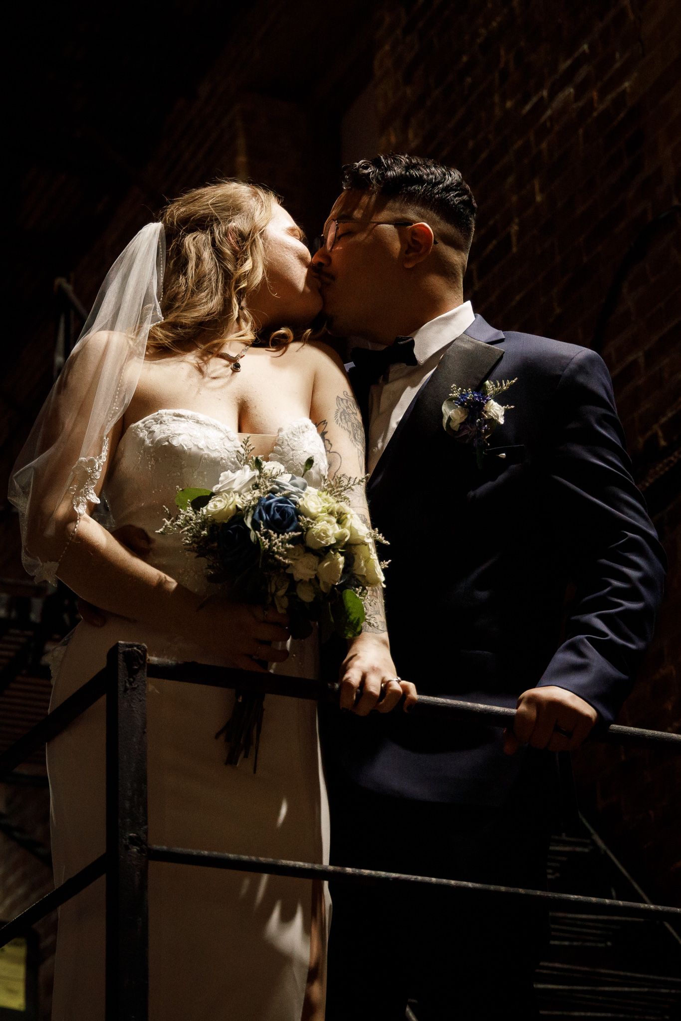 A series of romantic wedding photos showing intimate moments between newlyweds leaning against a dark railing.
