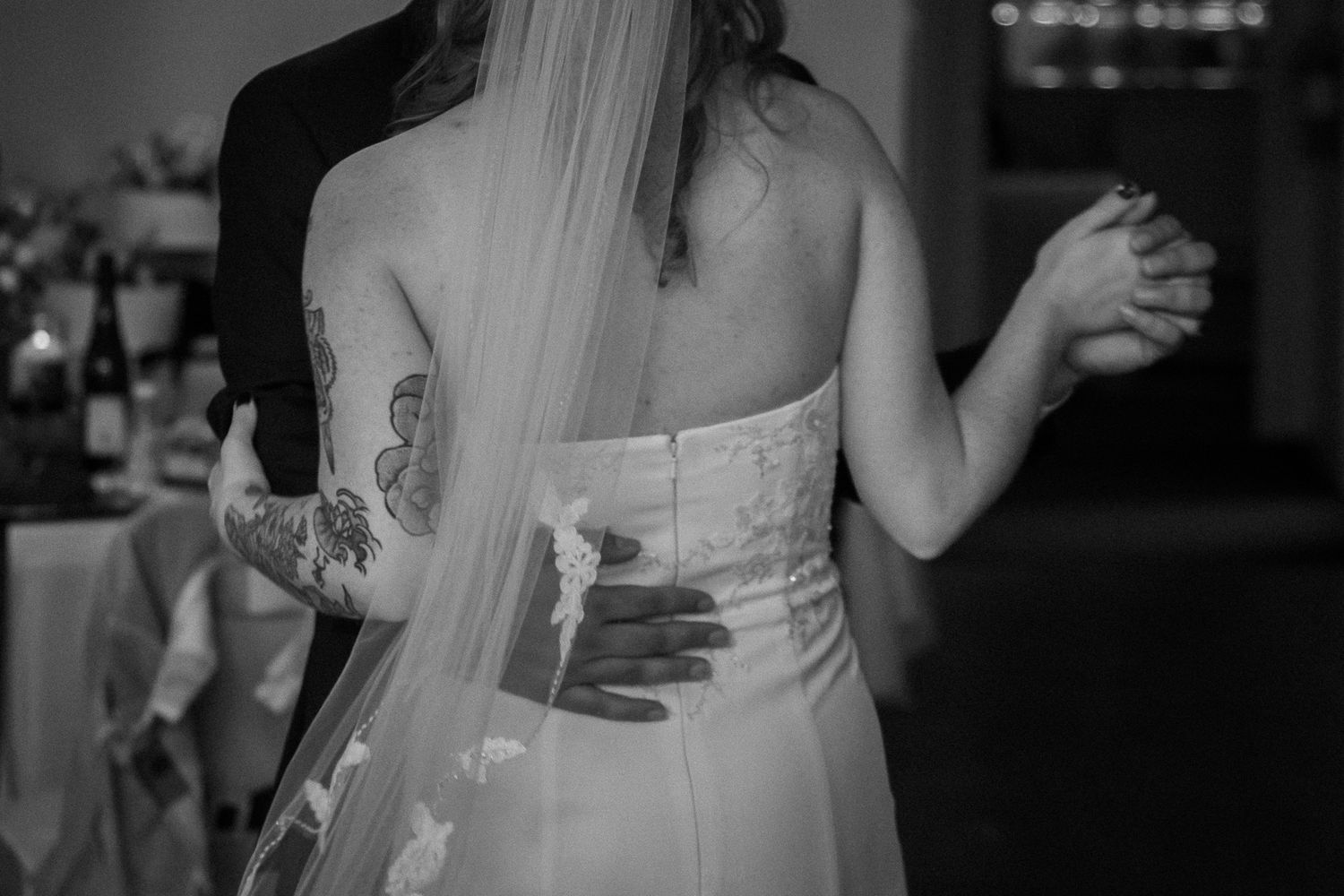Black and white wedding reception photos showing guests dancing and celebrating on the dance floor.