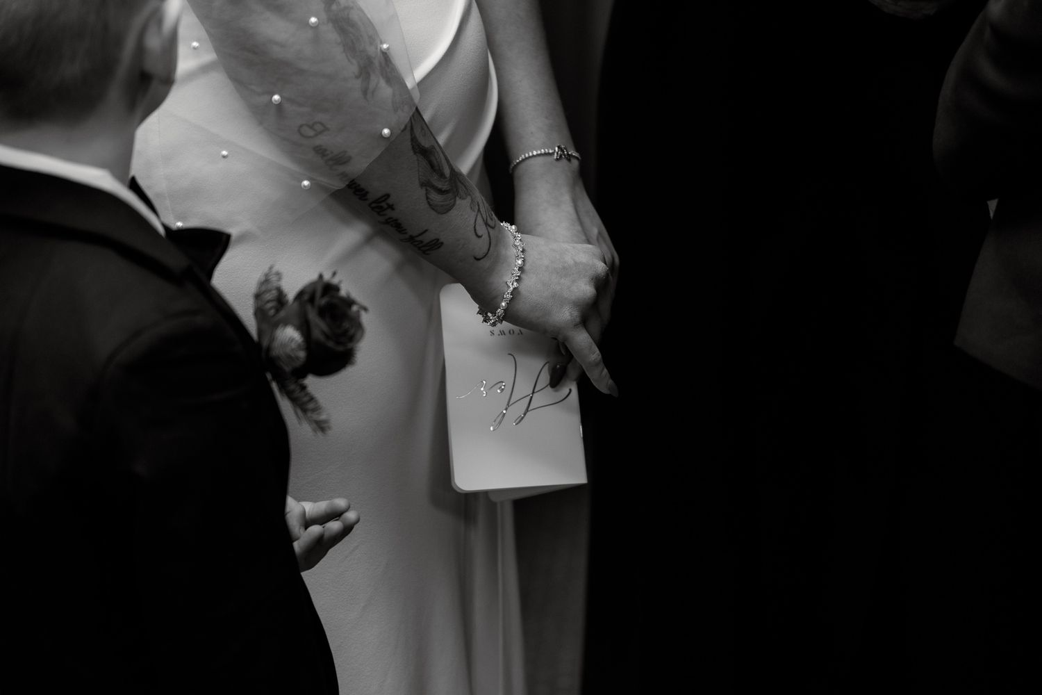 A couple exchanges rings during a traditional wedding ceremony in a church.