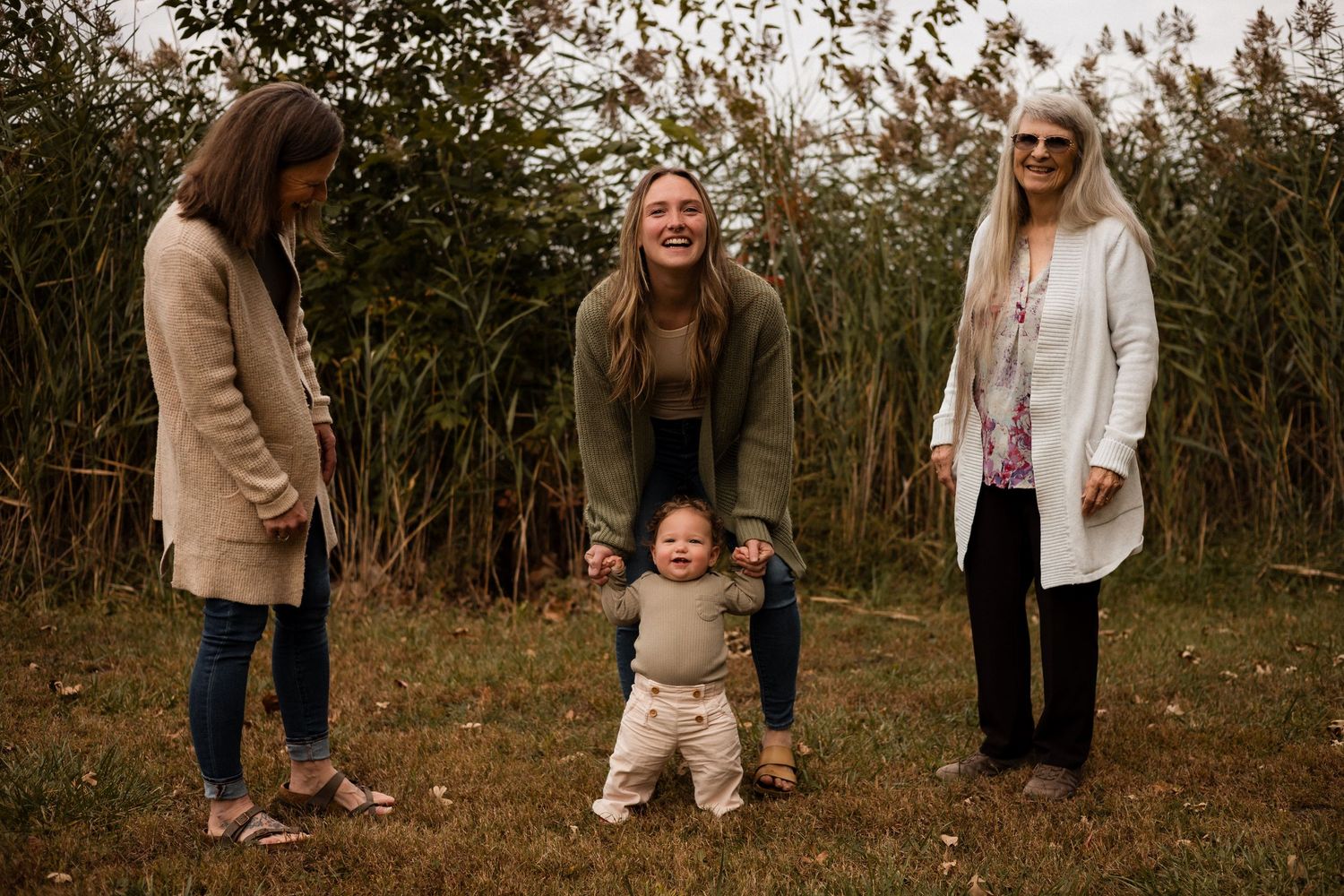 A collection of candid outdoor family photos showing people walking and interacting in a natural wooded setting.