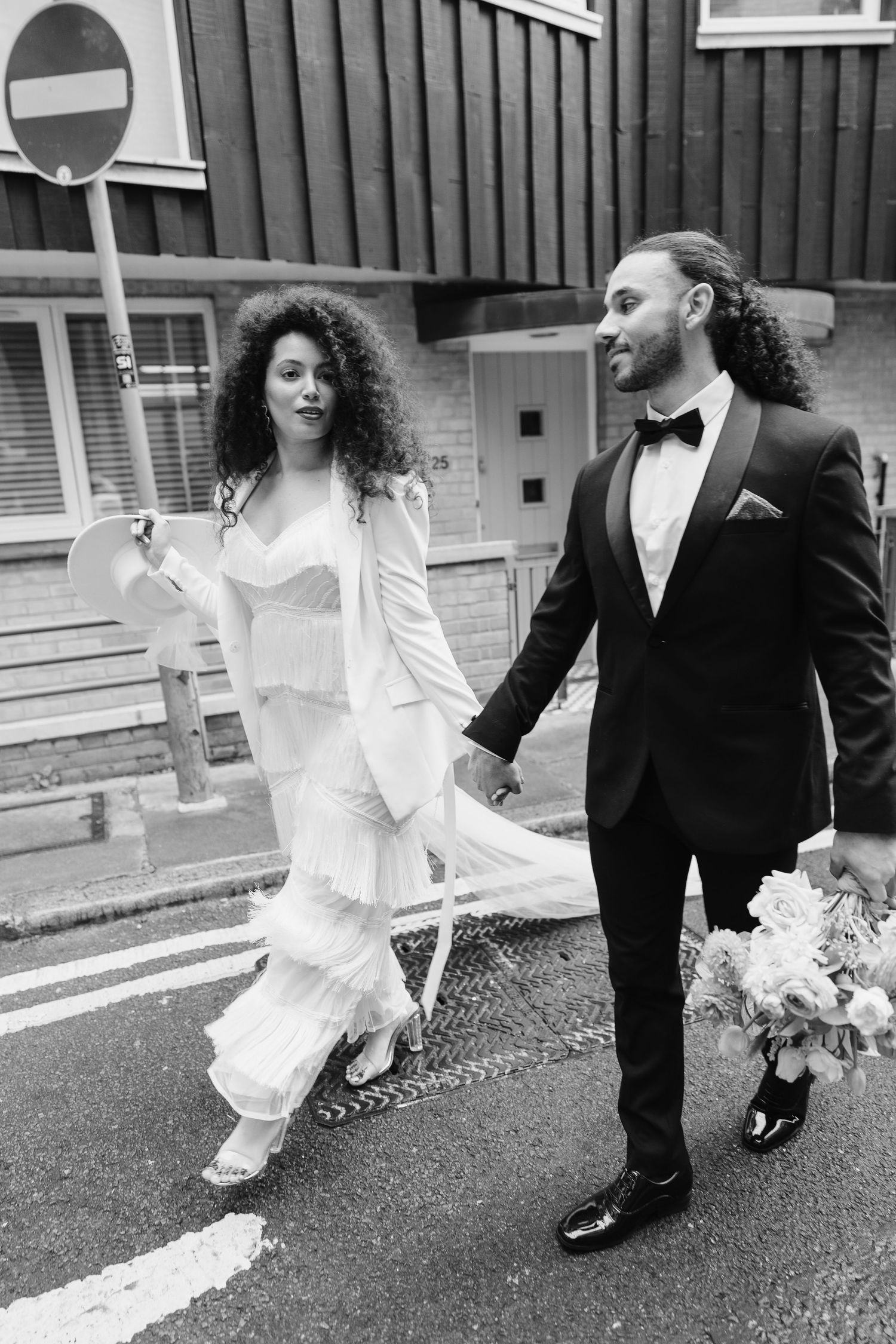 Relaxed wedding couple at The Hoxton, Holborn. London Wedding Photographer.  vibrant bouquet flowers