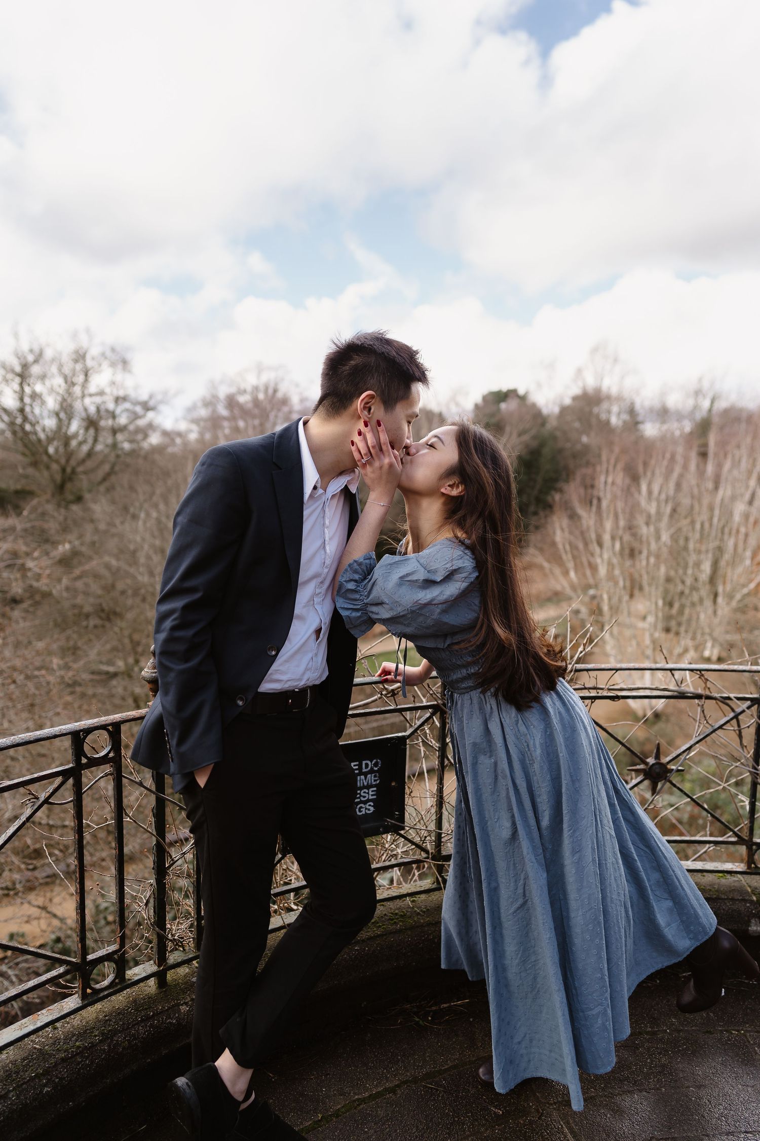 A loving embrace as the sun streams through walkway Hampstead Heath Pergola destination photographer
