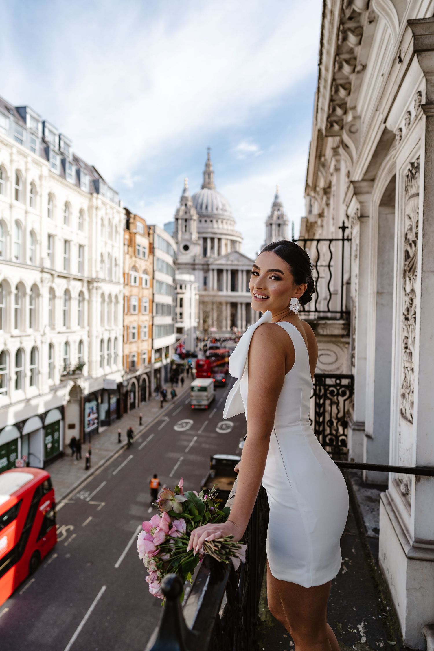 Luxury Bride on Parisian-style balcony overlooking St Paul's Cathedral in London for his wedding elopement.