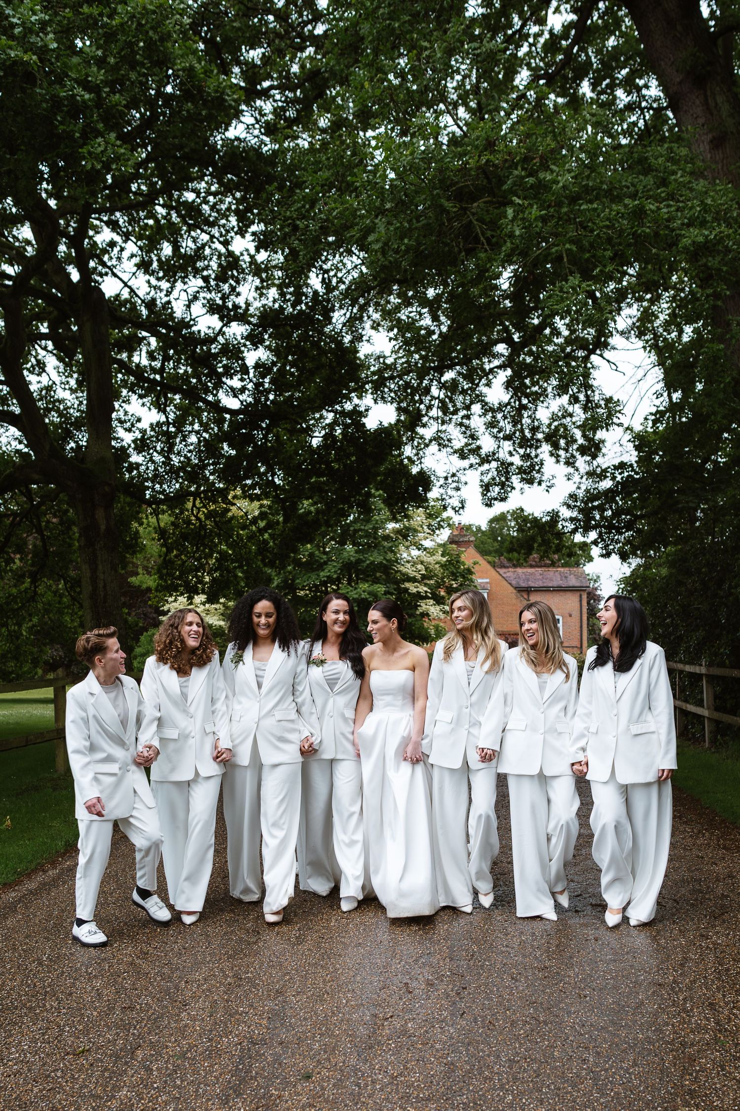 Luxury Bridesmaid inspiration with Bridesmaids wearing white elegant suits with Hannah dazzling in her Vera Wang gown.