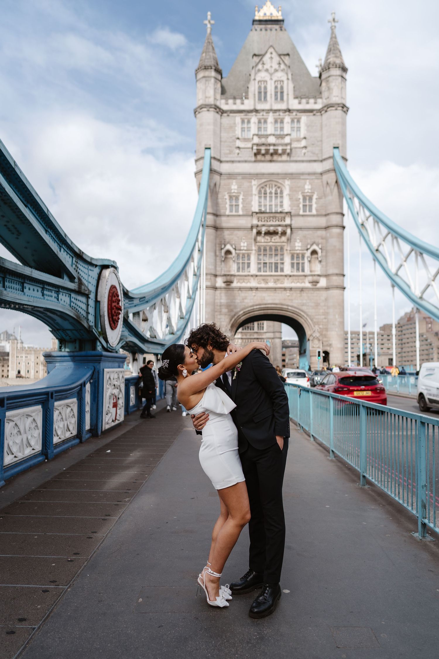 Luxury wedding photos at Tower Bridge. Bride short dress. documentary. Editorial. London Wedding Photographer. romantic