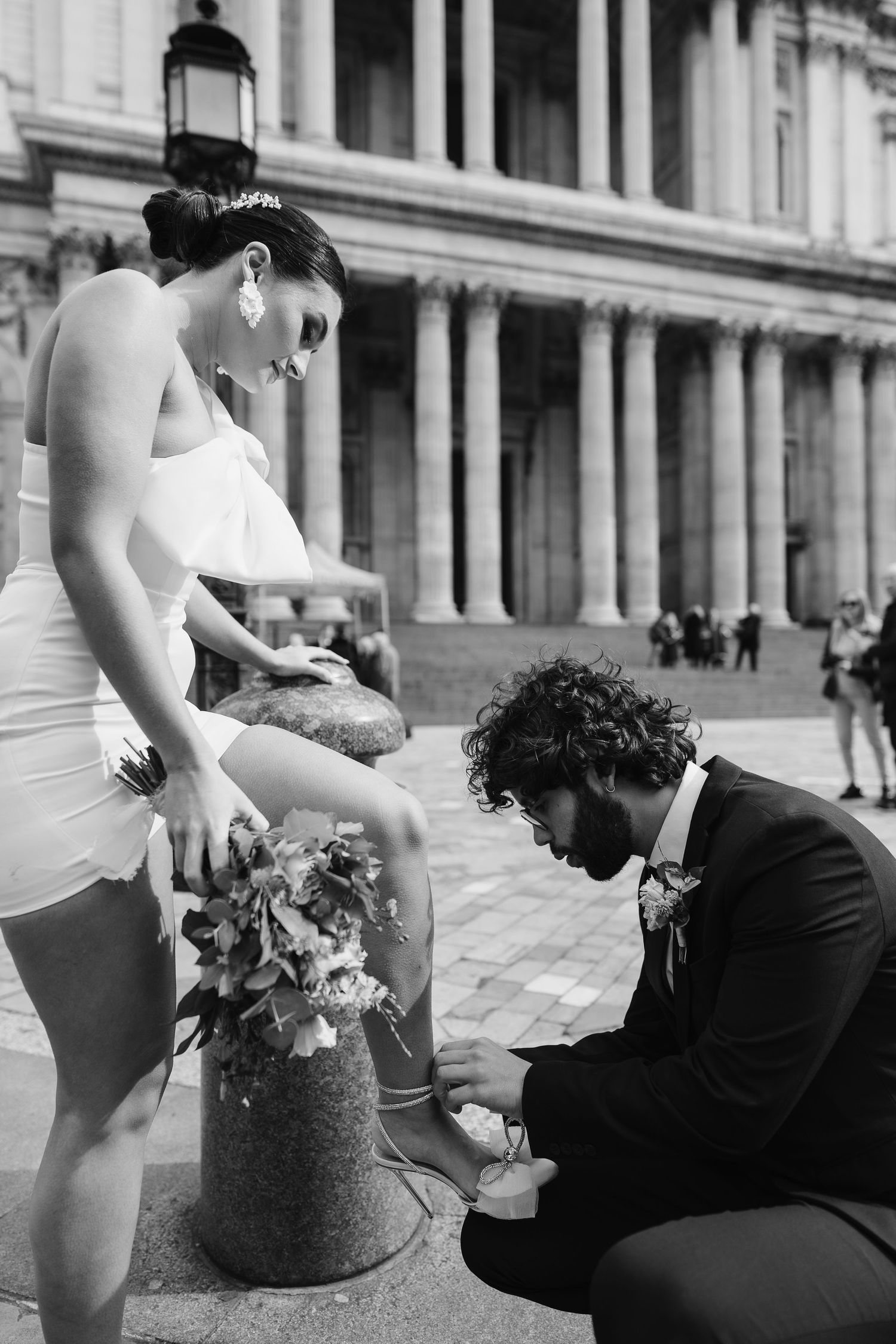 Luxury Bride & Groom walking past St Paul's Cathedral in London on wedding elopement. Wedding photographer