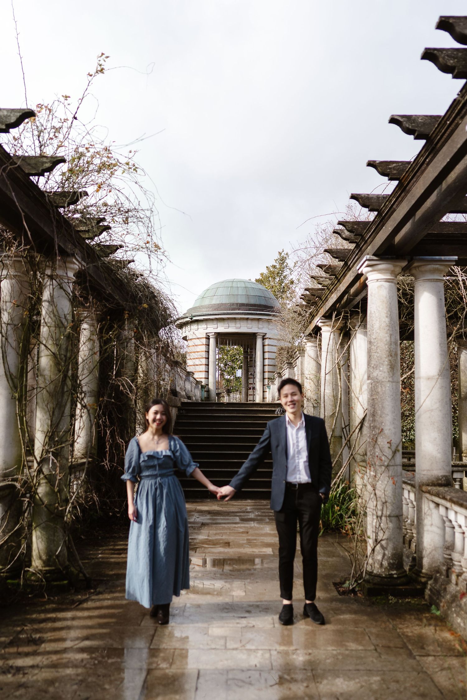 A relaxing stroll and chat through the puddles with the greenery hanging down Hampstead Heath London venue photographer
