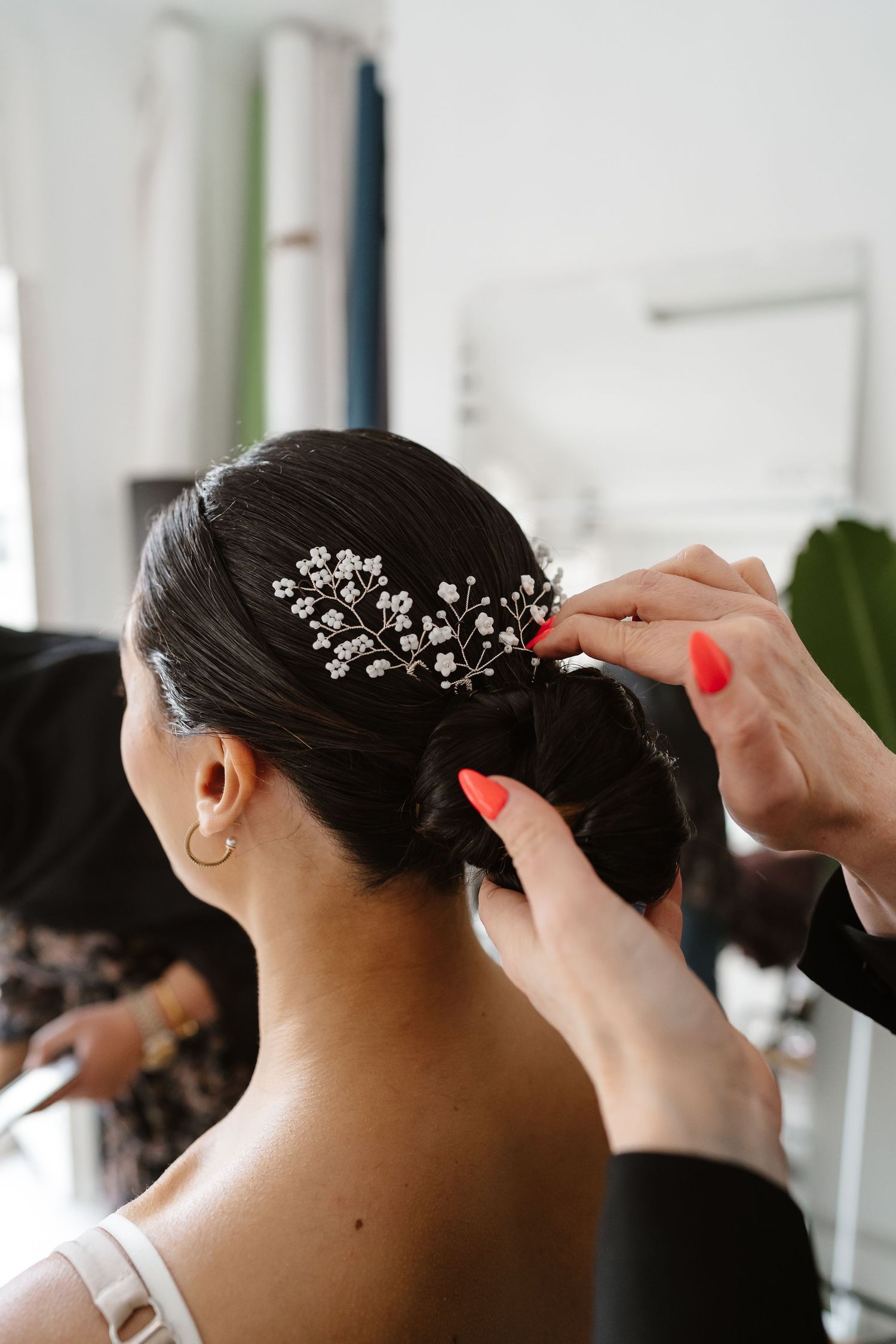 Make up artist and Hair stylist during bridal prep in London St Paul's for Wedding bridal hair and make up. London Weddi