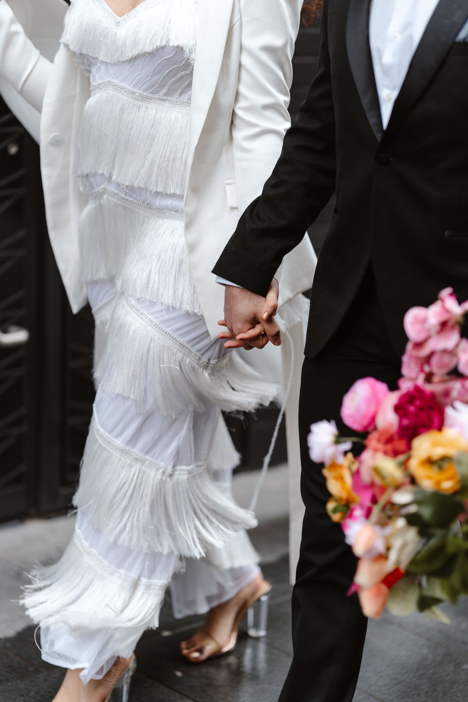Relaxed wedding couple at The Hoxton, Holborn. London Wedding Photographer.  vibrant bouquet flowers