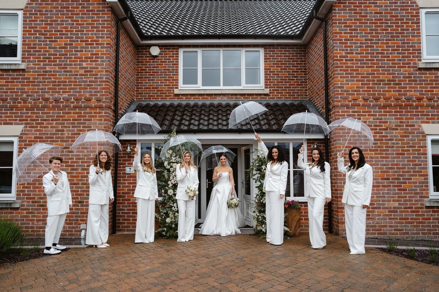 Even the rain couldn't dampen this elegant fun day with bridesmaids and their umbrellas. Luxury Wedding Inspo