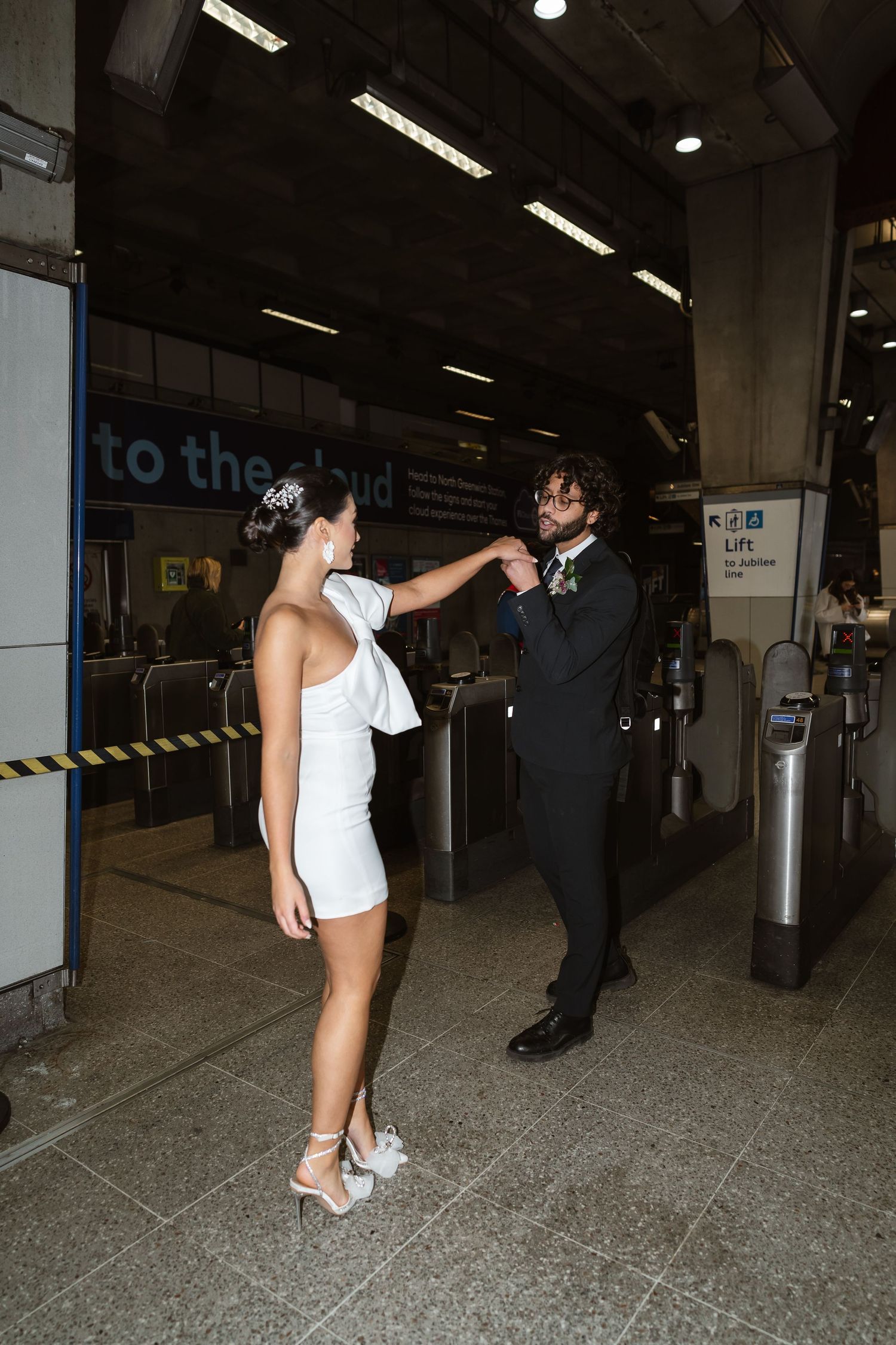 bride and groom in the London Underground Tube, direct flash editorial photography. Modern fun wedding photos. London