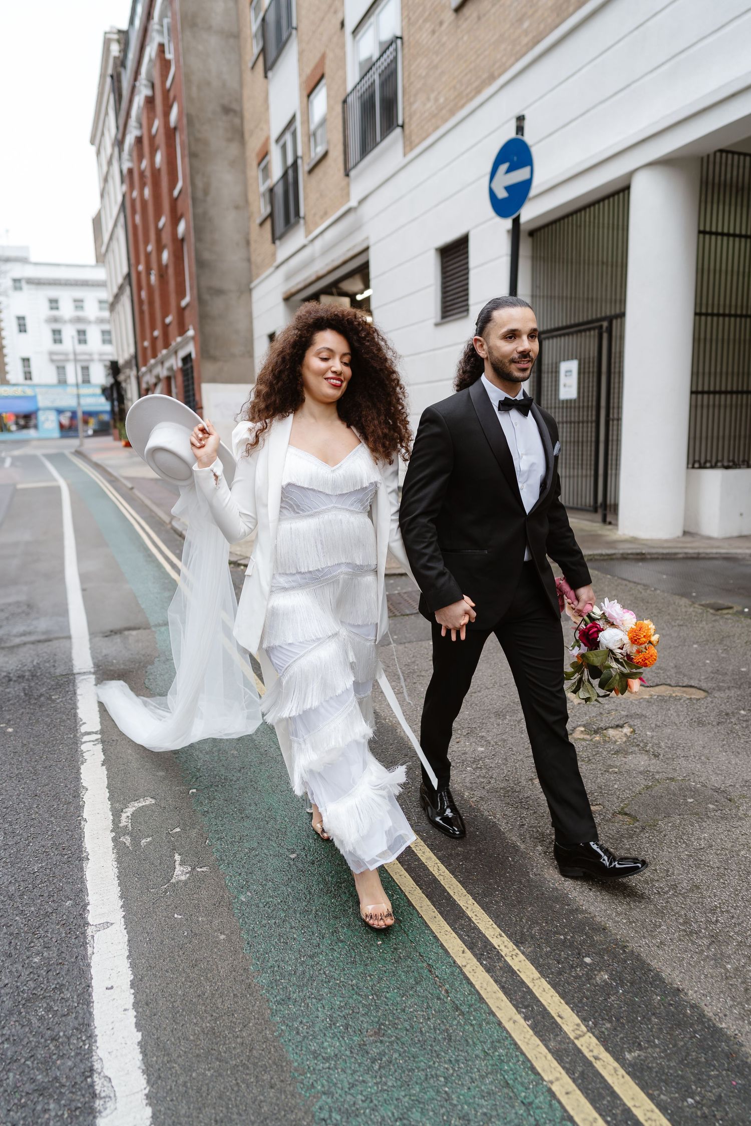 Relaxed wedding couple at The Hoxton, Holborn. London Wedding Photographer.  vibrant bouquet flowers