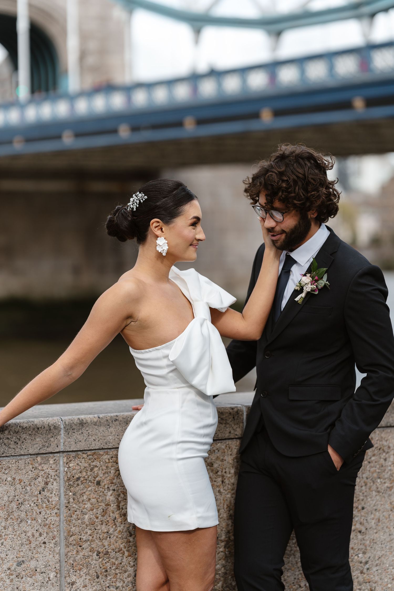 Luxury wedding photos at Tower Bridge. Bride short dress. Fun photos. Editorial. London Wedding Photographer