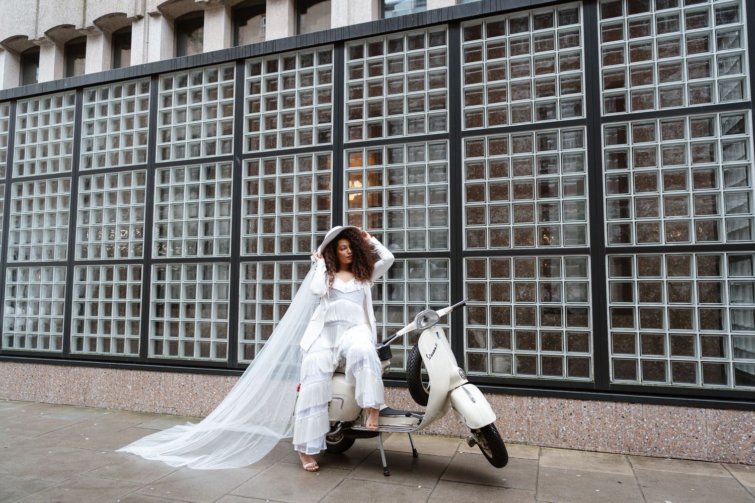 Relaxed wedding couple at The Hoxton, Holborn. London Wedding Photographer.  vibrant bouquet flowers