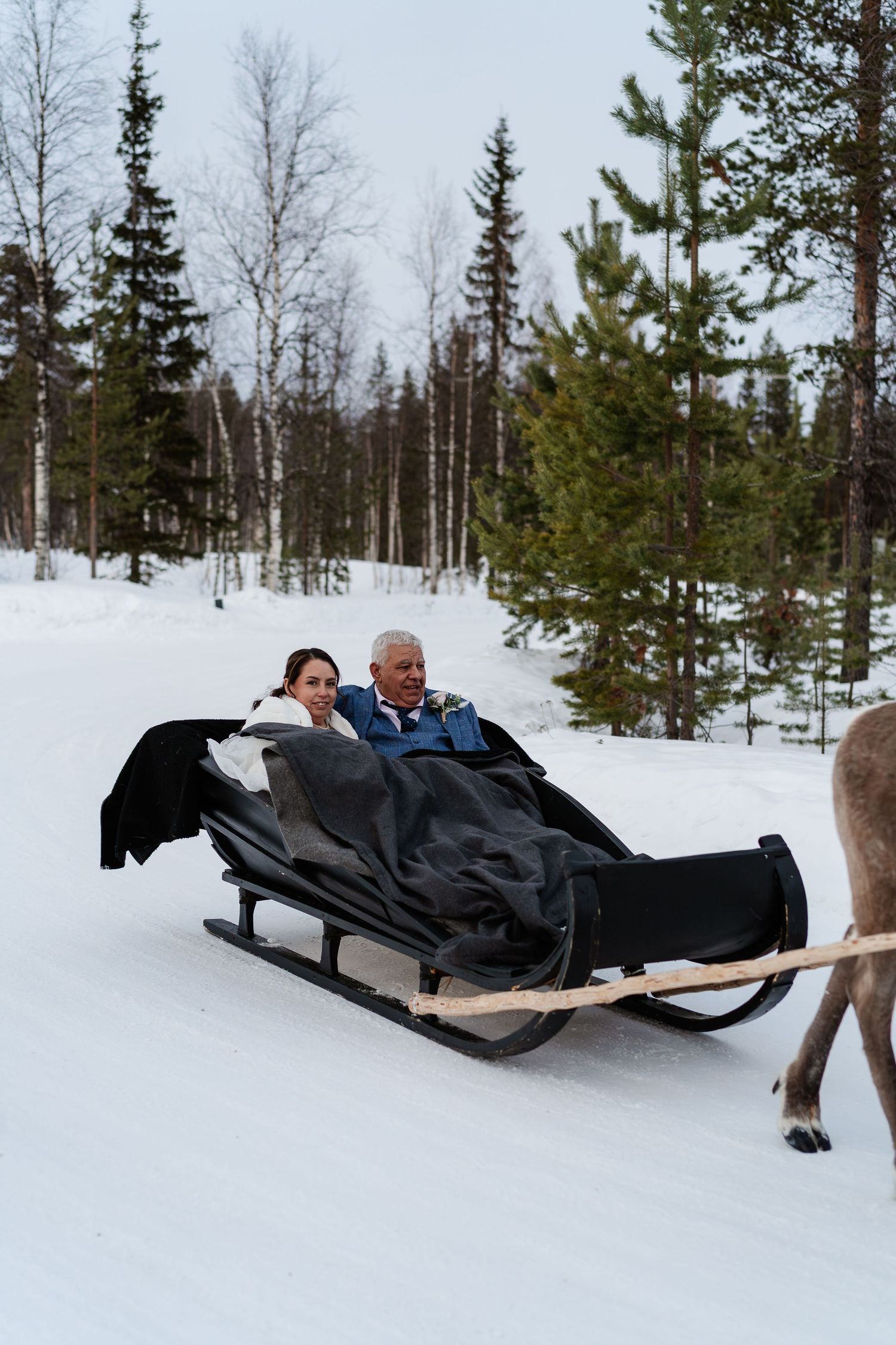 Reindeer sleigh ride on wedding day in Lapland. Eloping in Lapland. Marry in Lapland. Unique Wedding Experience in Lapland. Photographer.