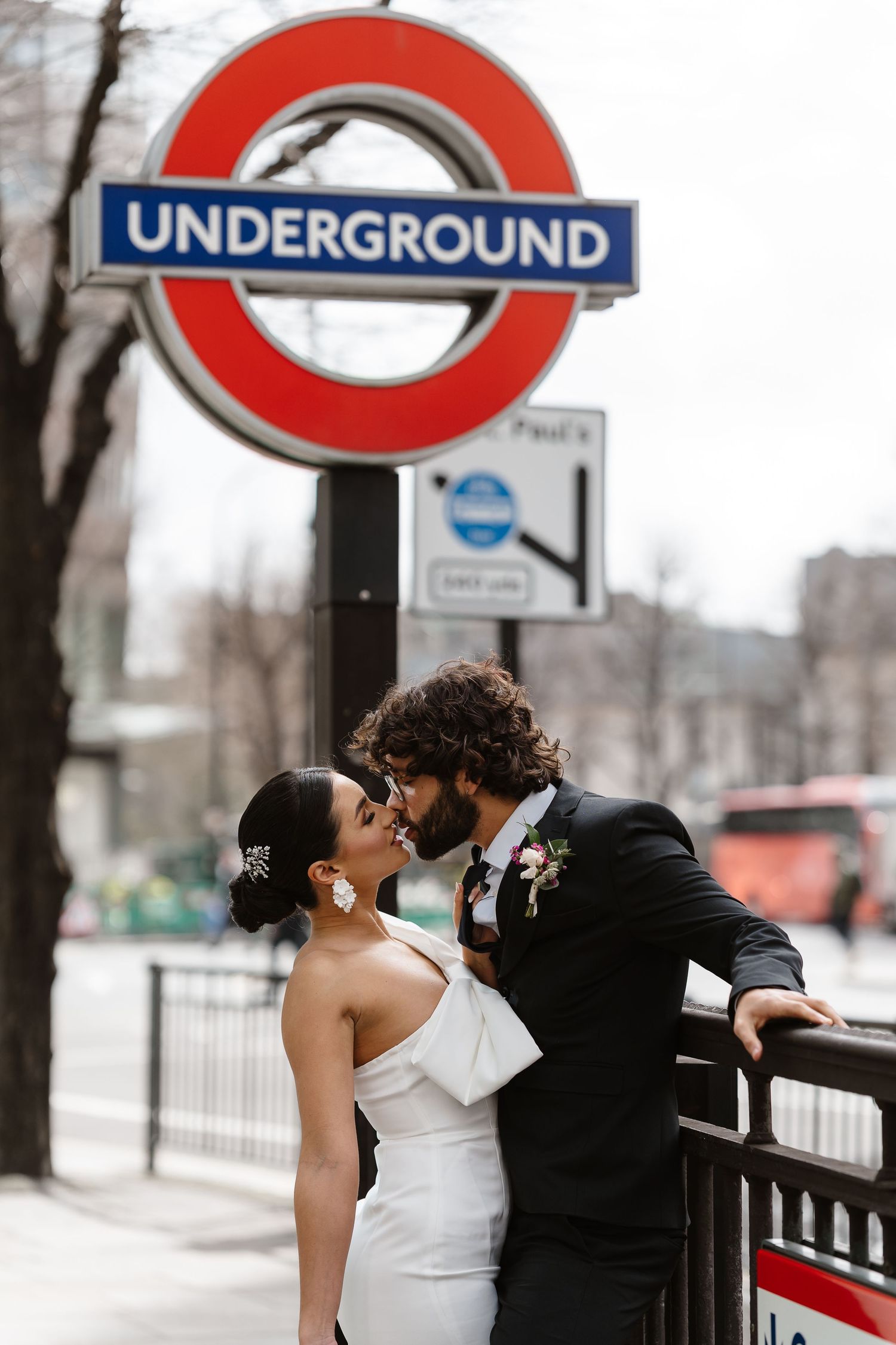Bride and groom on London Underground tube wedding photos. Taken by London Wedding Photographer