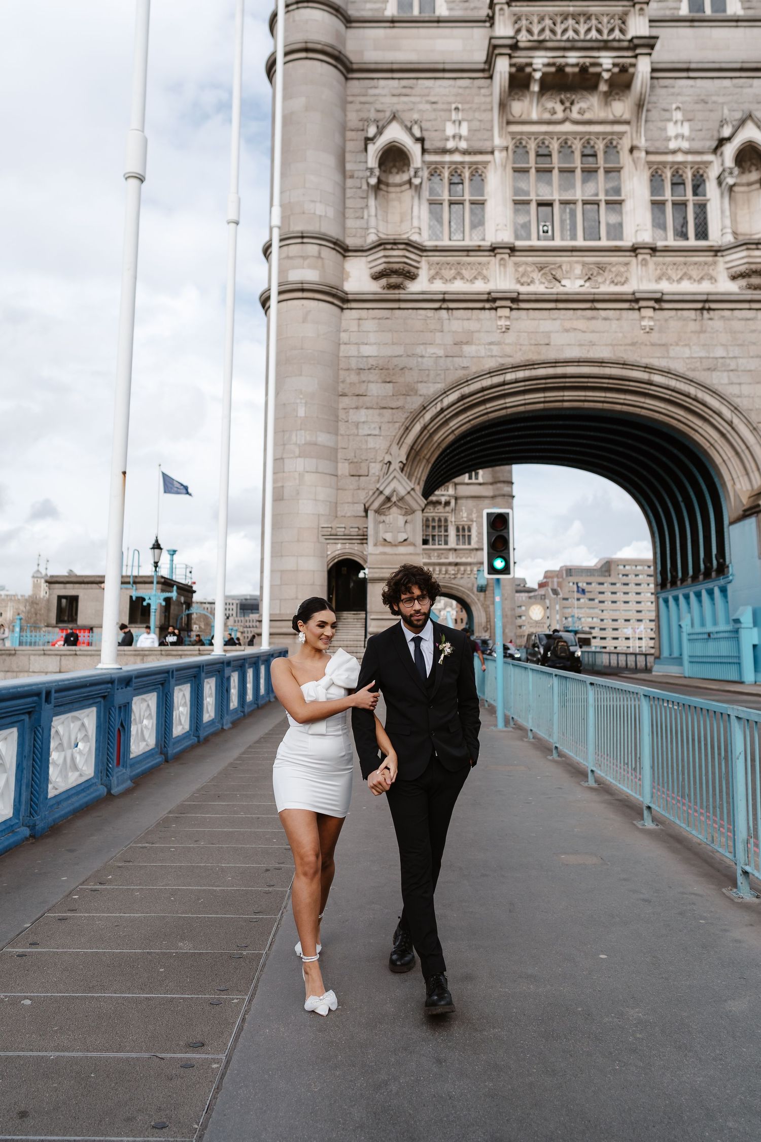 Luxury wedding photos at Tower Bridge. Bride short dress. Fun photos. Relaxed. London Wedding Photographer. romantic