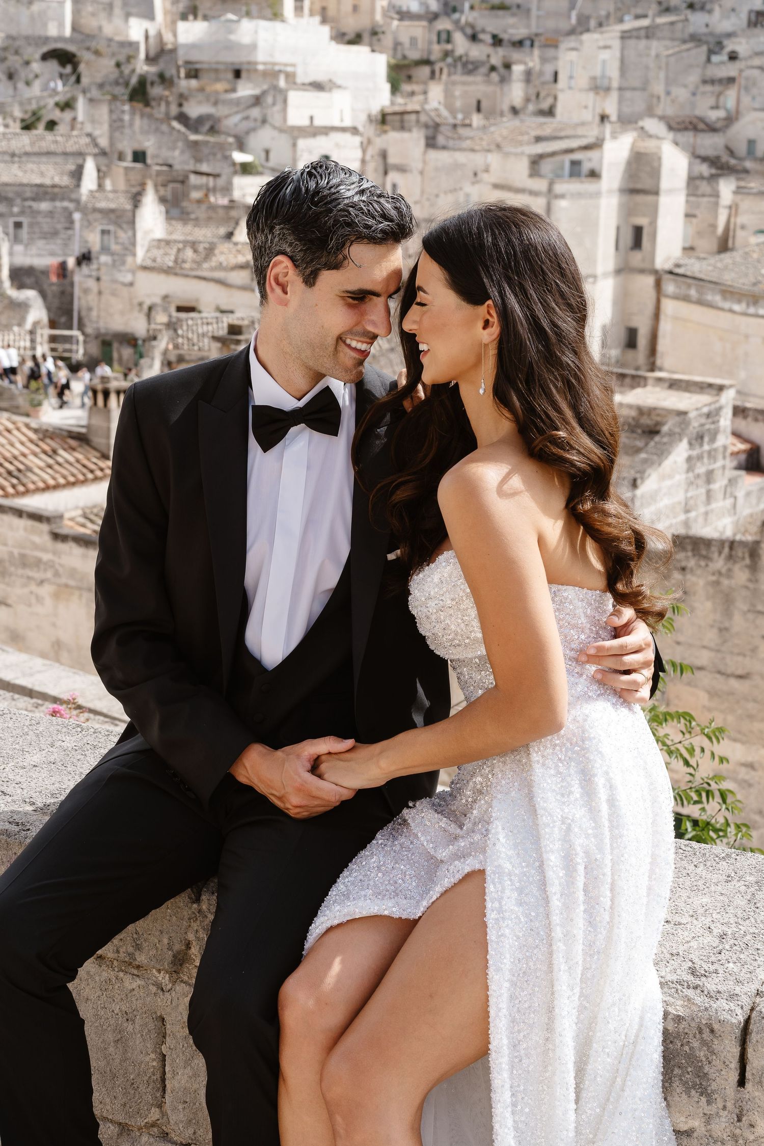 Romantic/intimate tender embrace loving look, old town backdrop